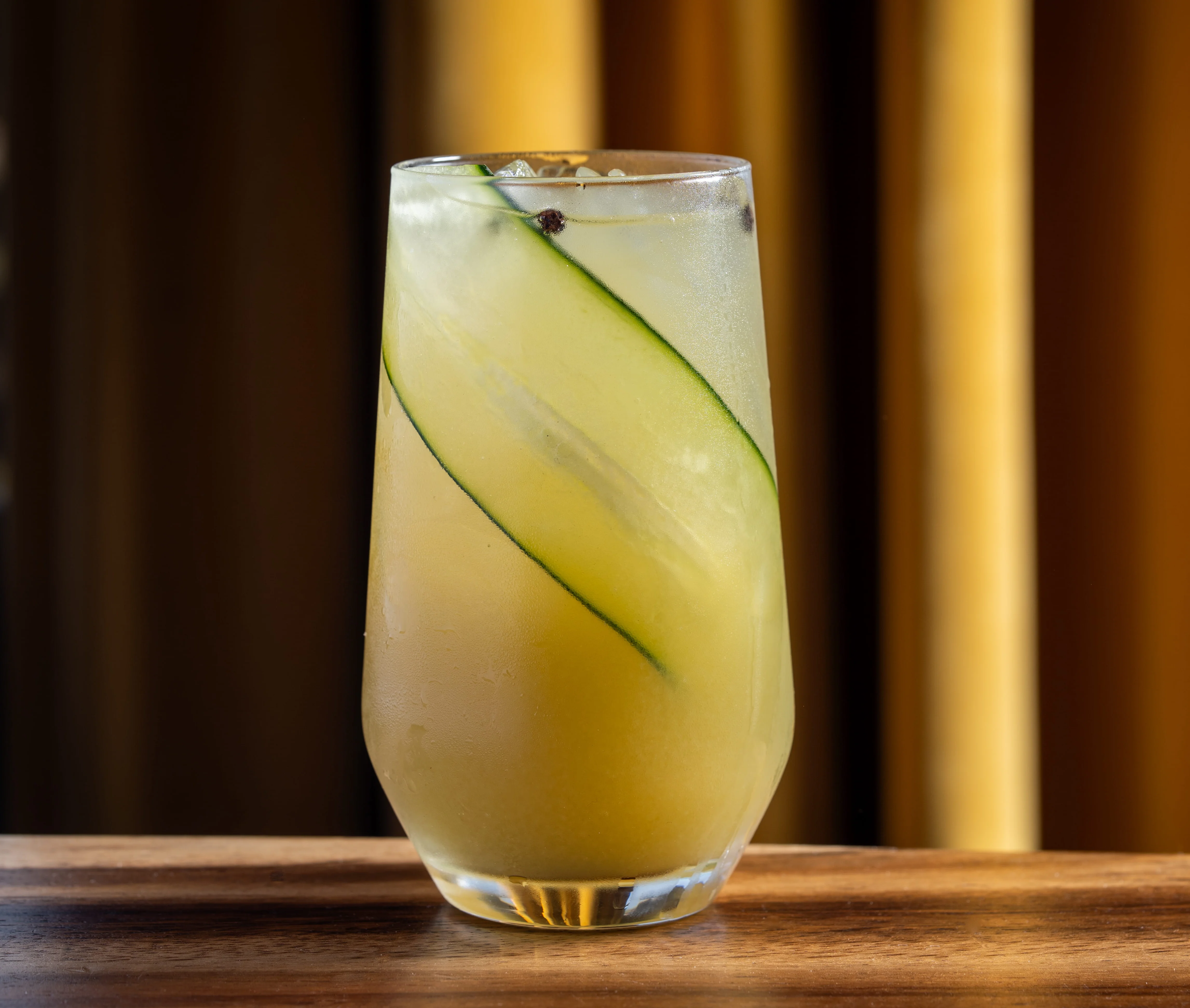 Refreshing cucumber cocktail in a tall glass