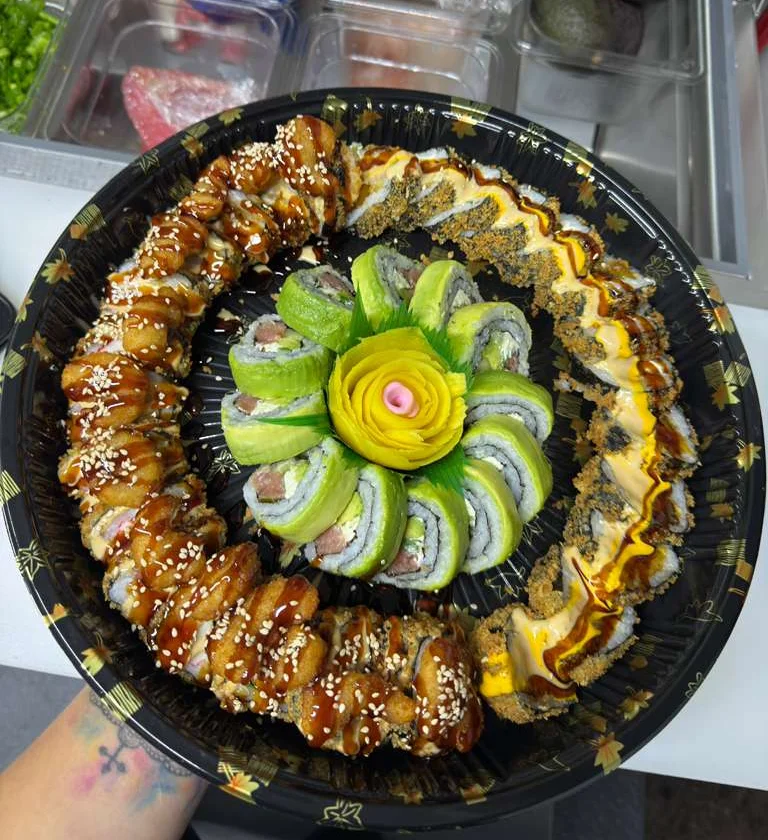 Artfully arranged sushi platter with various rolls