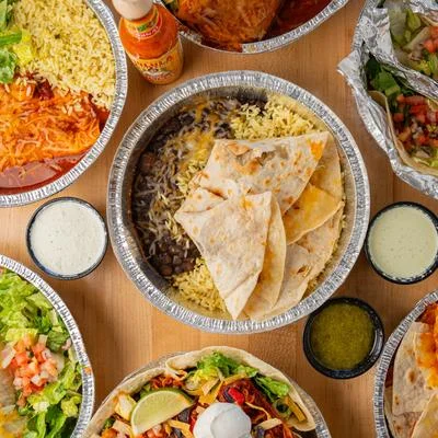 Colorful Mexican burrito bowls with toppings and sauces