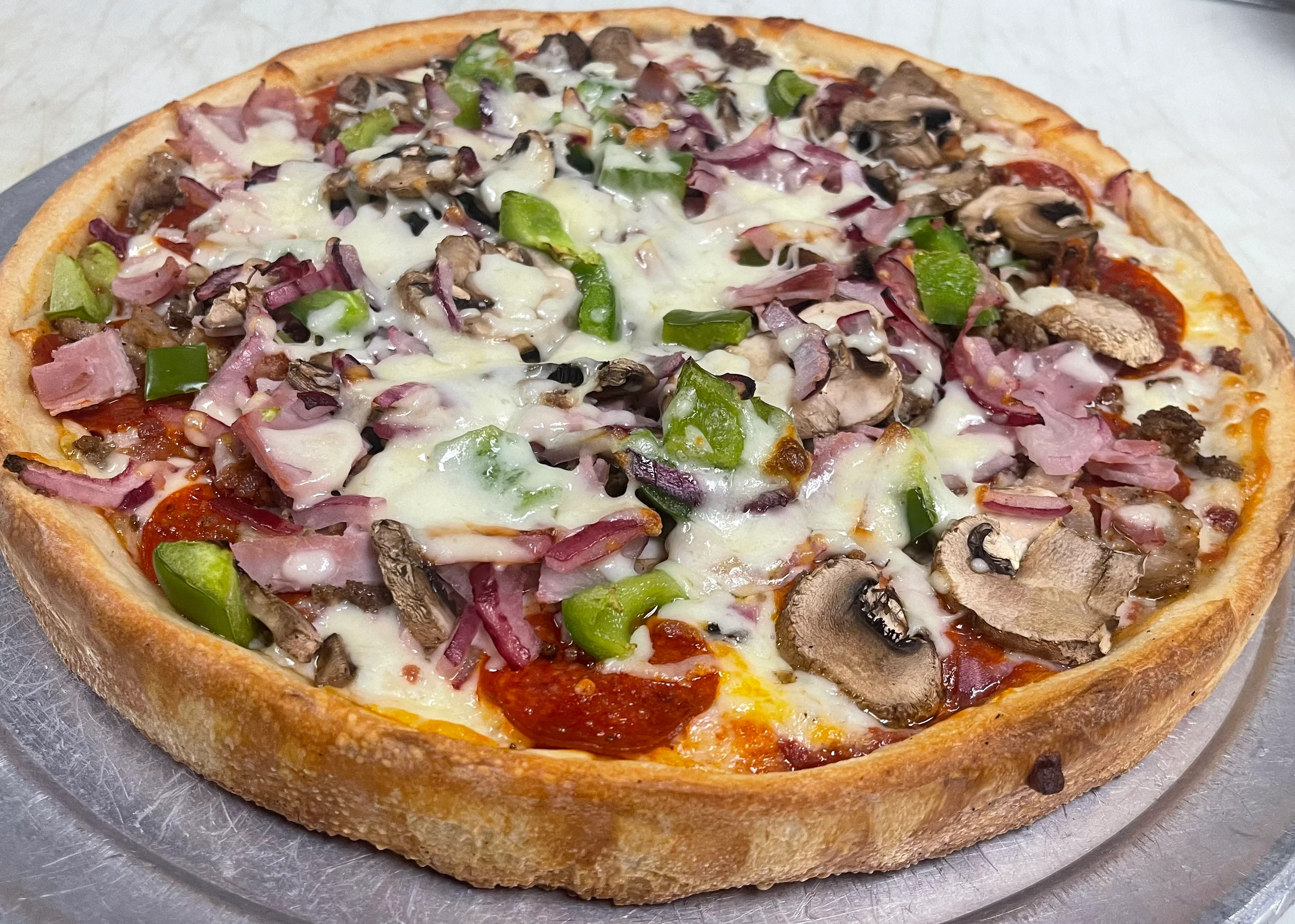 Loaded supreme pizza with various toppings