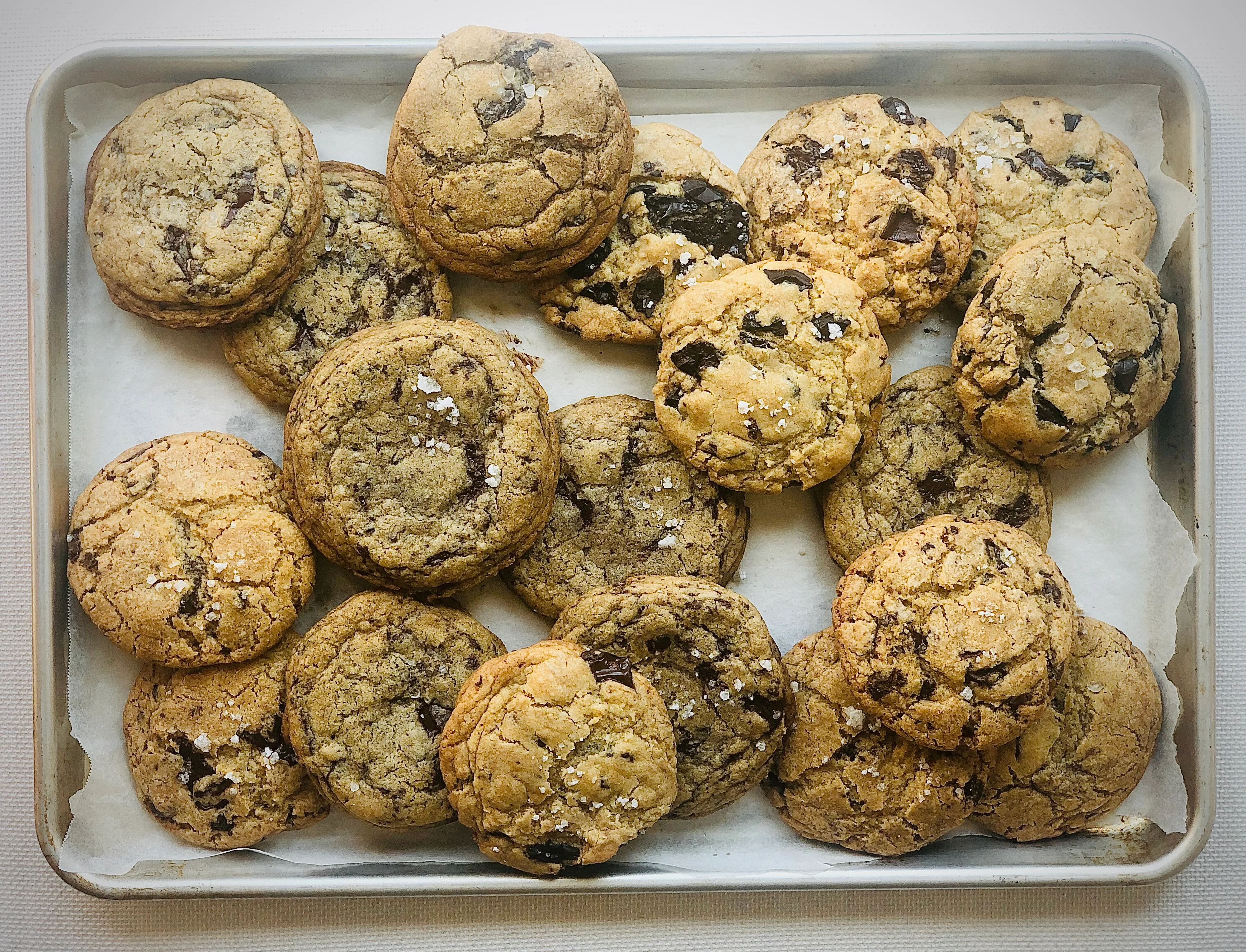 Freshly baked chocolate chip cookies on a tray