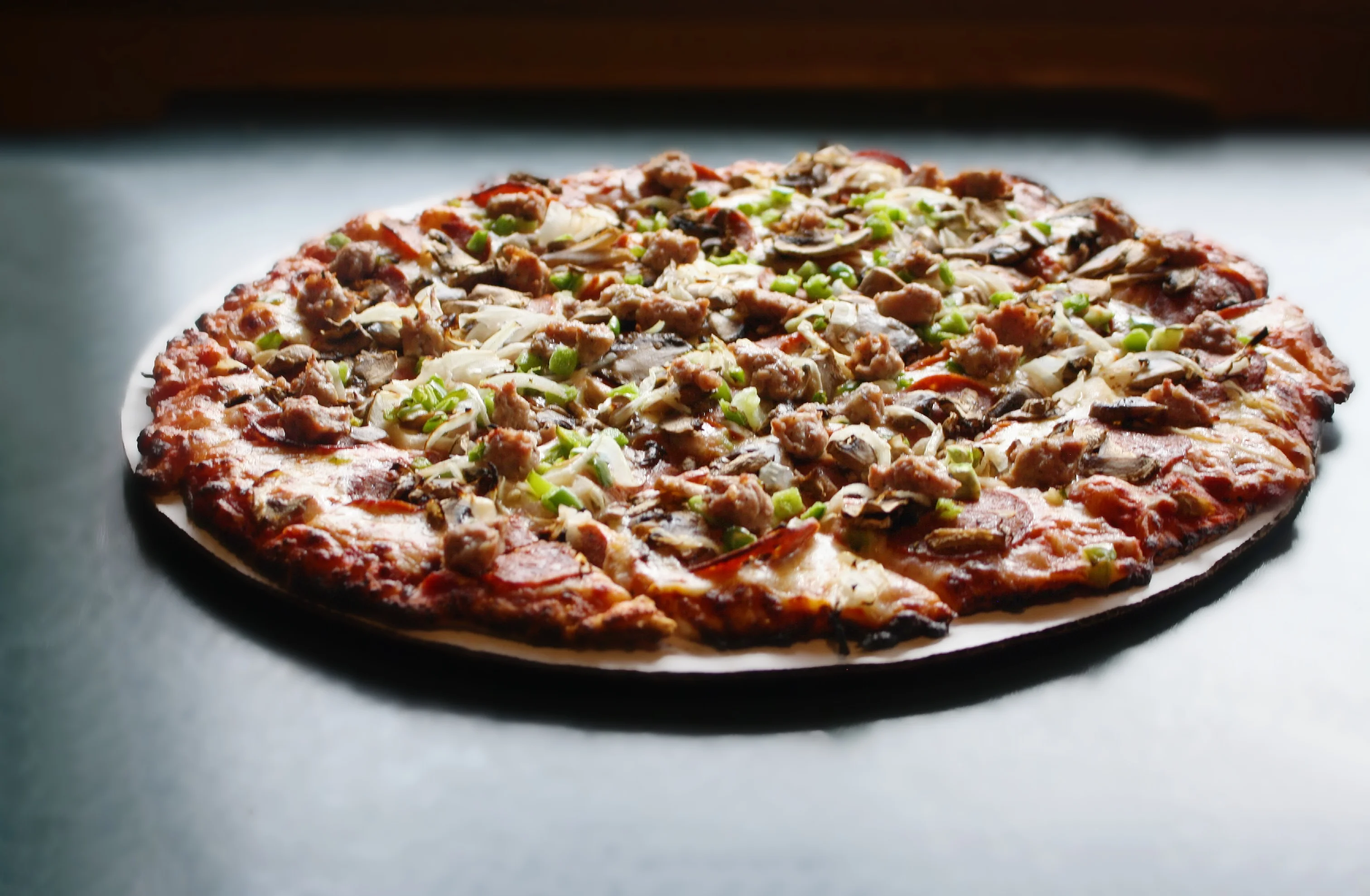 Loaded meat pizza with fresh toppings