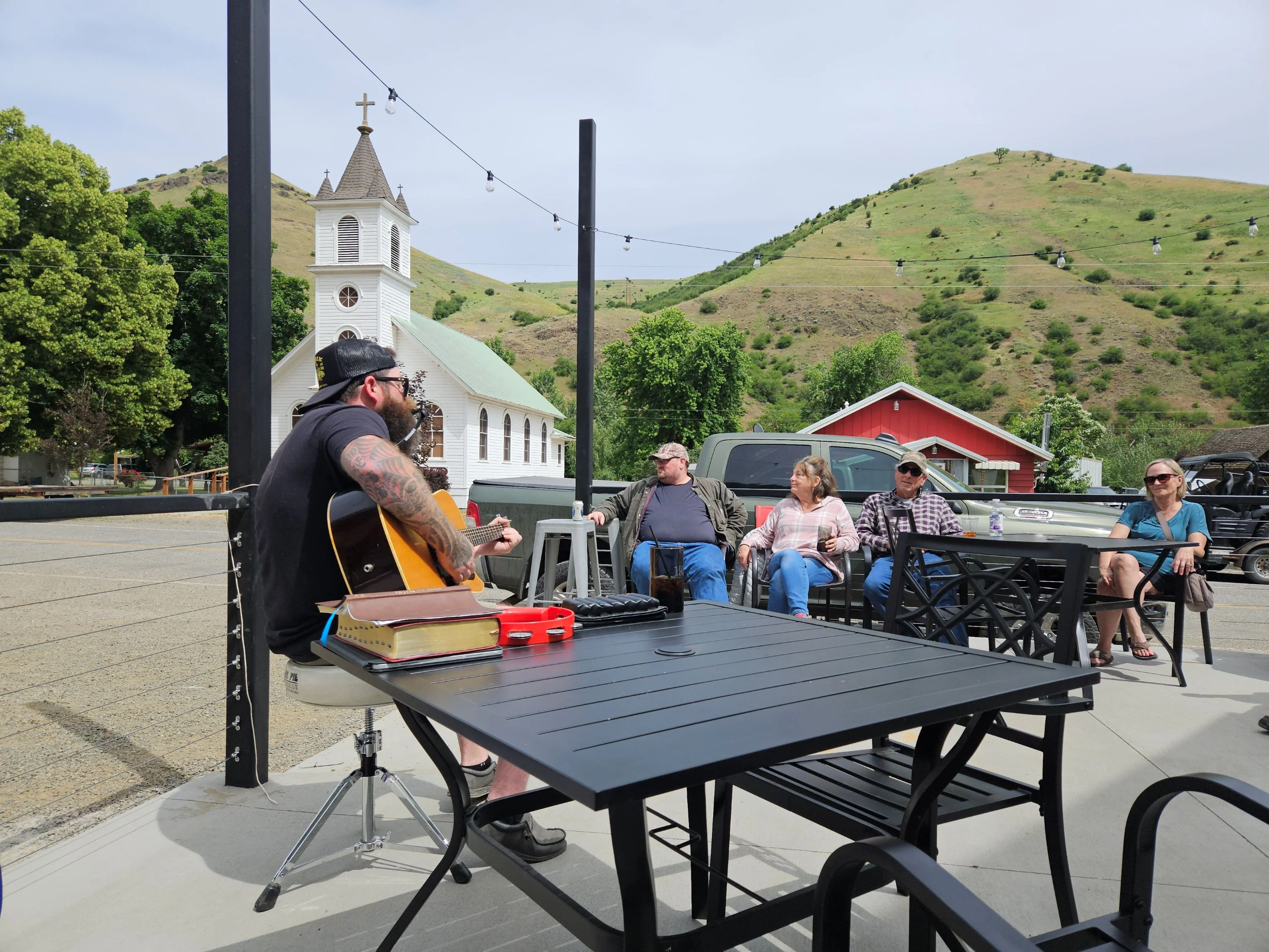 Live music performance in a scenic outdoor dining area