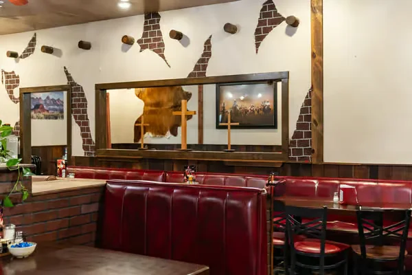 Delicious gourmet burger with fresh toppings on a wooden table