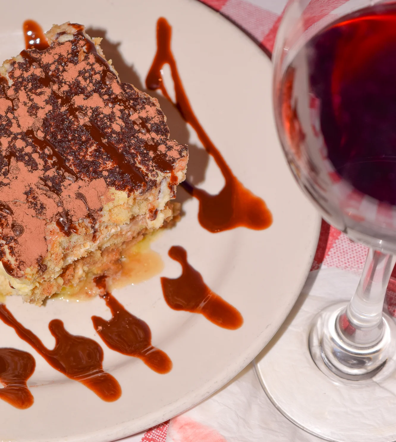 Baked lasagna with melted cheese in a cozy restaurant setting