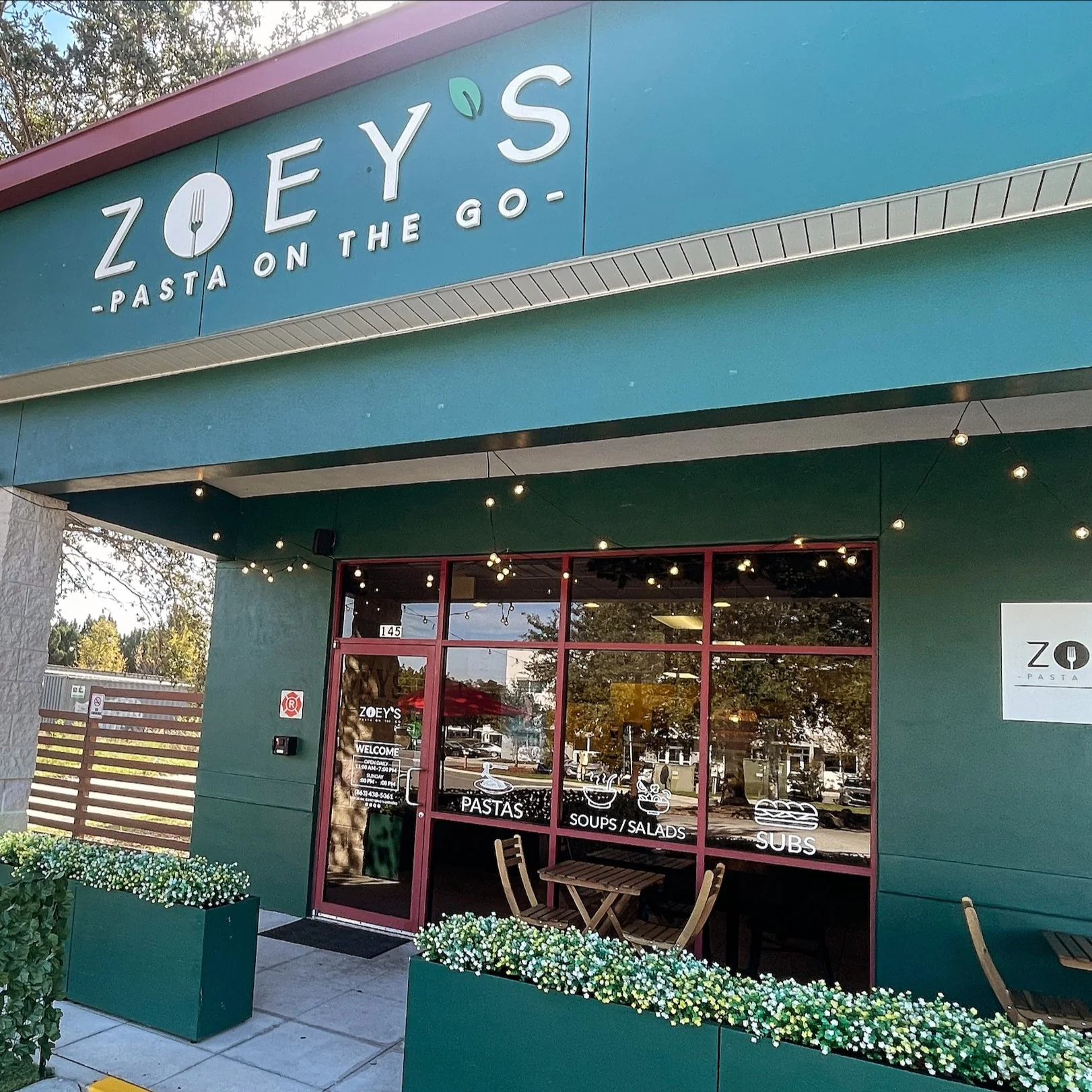 Exterior of Zoey's Pasta on the Go restaurant with outdoor seating