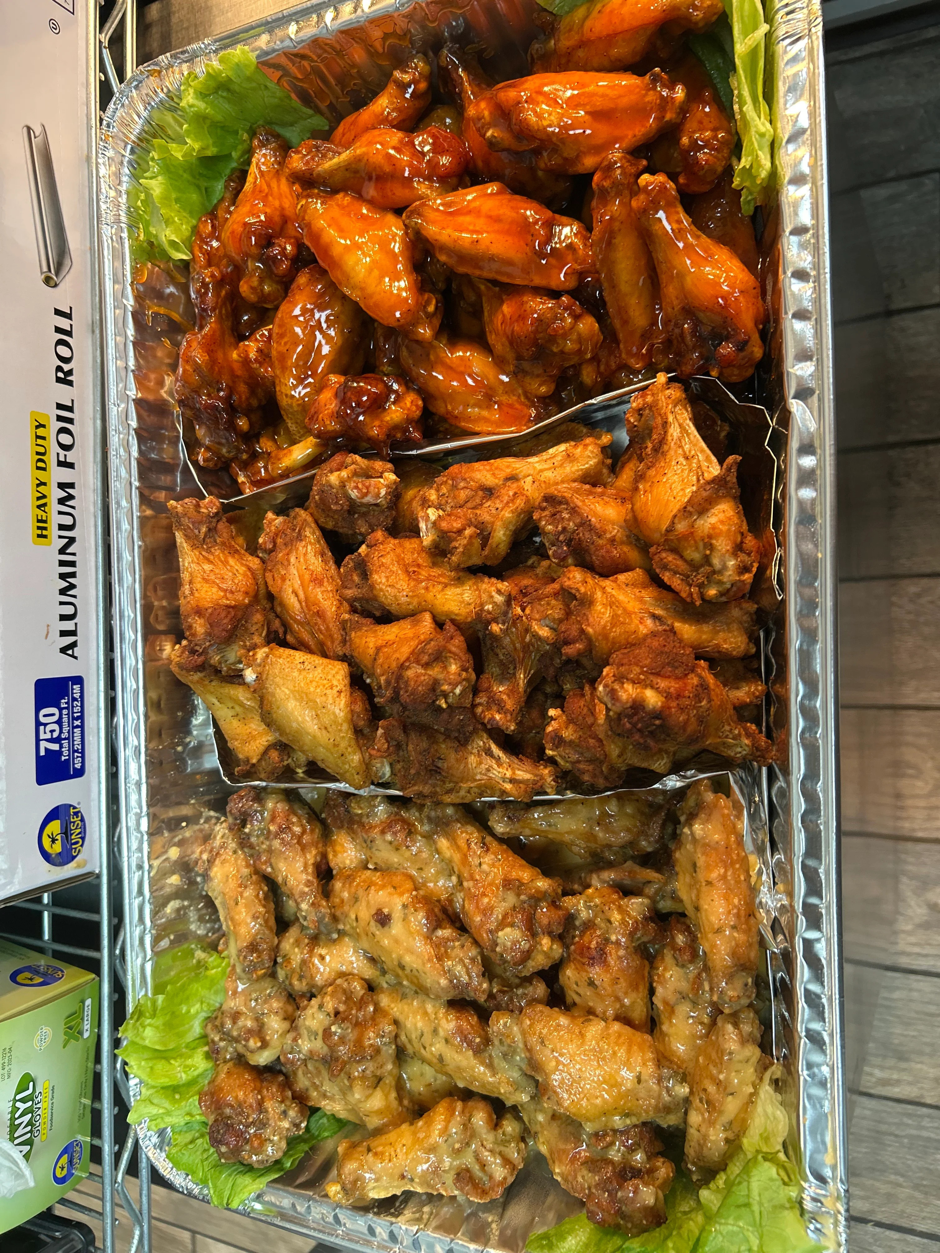 Assorted chicken wings platter with various sauces