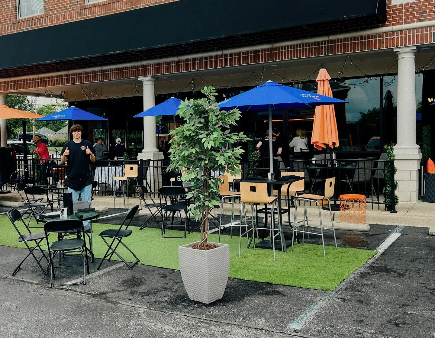 Outdoor dining area with colorful umbrellas and seating