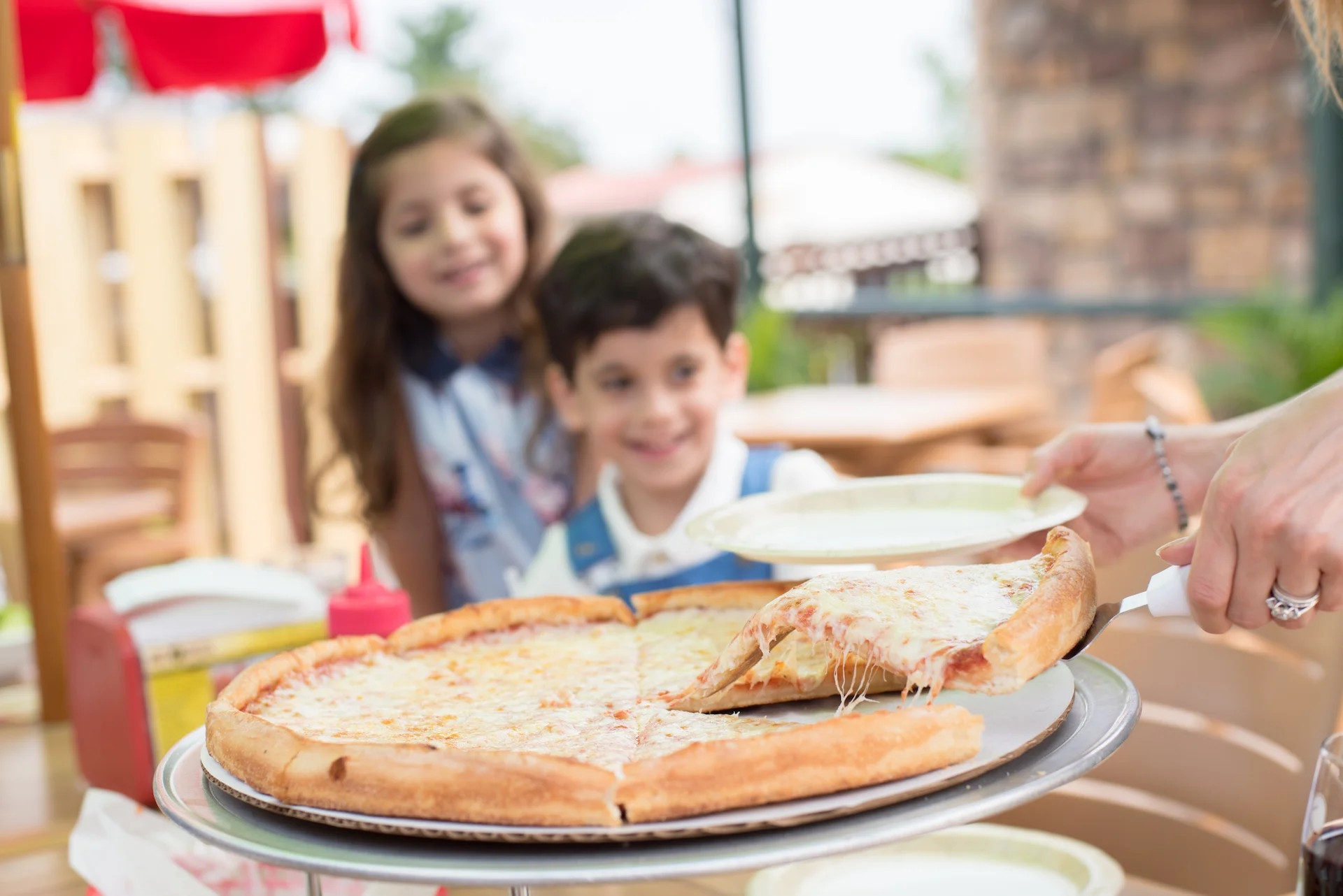 Cheesy Margherita pizza served at a family-friendly restaurant