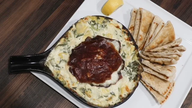 Baked Turkish spinach and cheese dish with pita bread