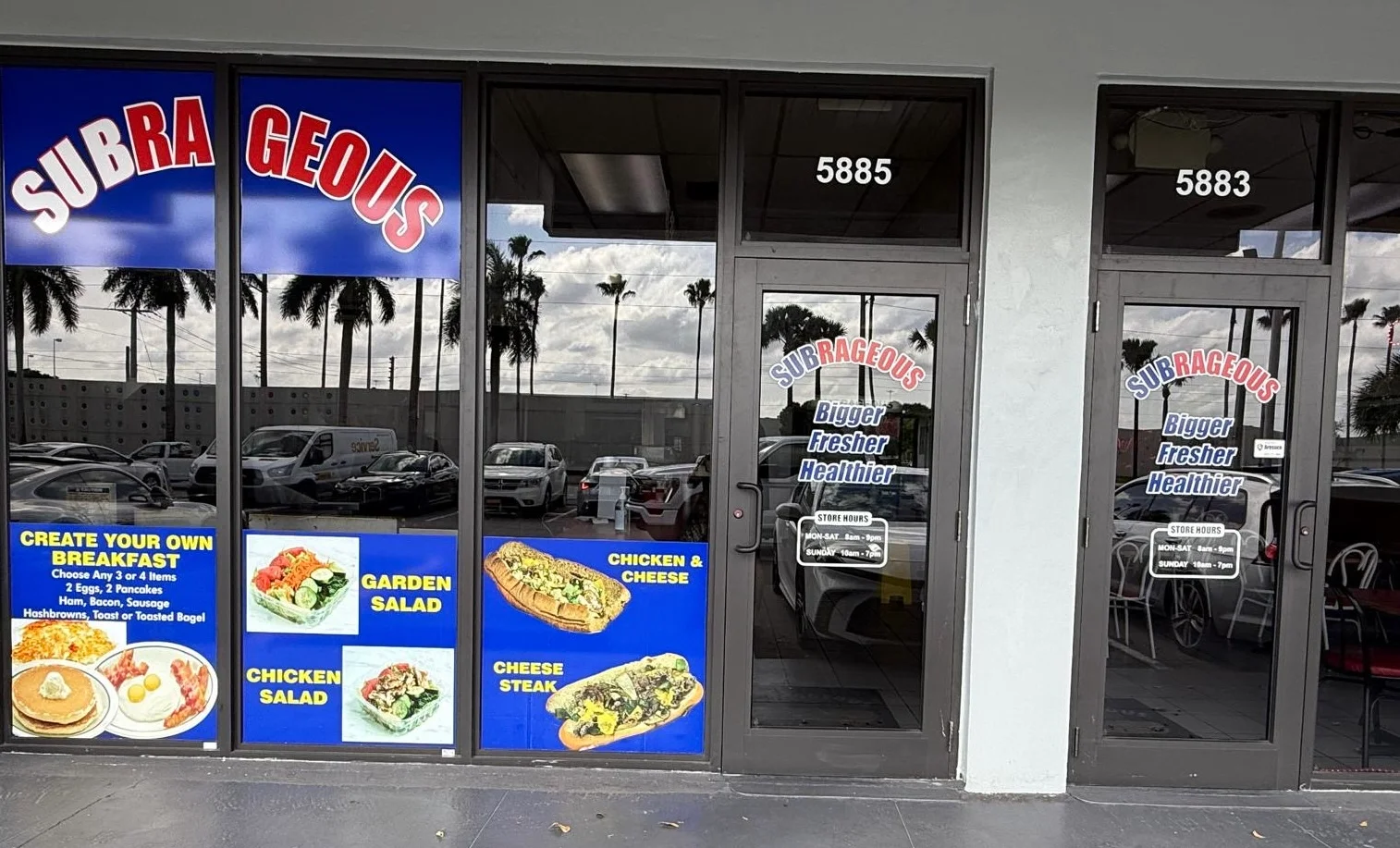 Restaurant storefront featuring fresh salads and sandwiches