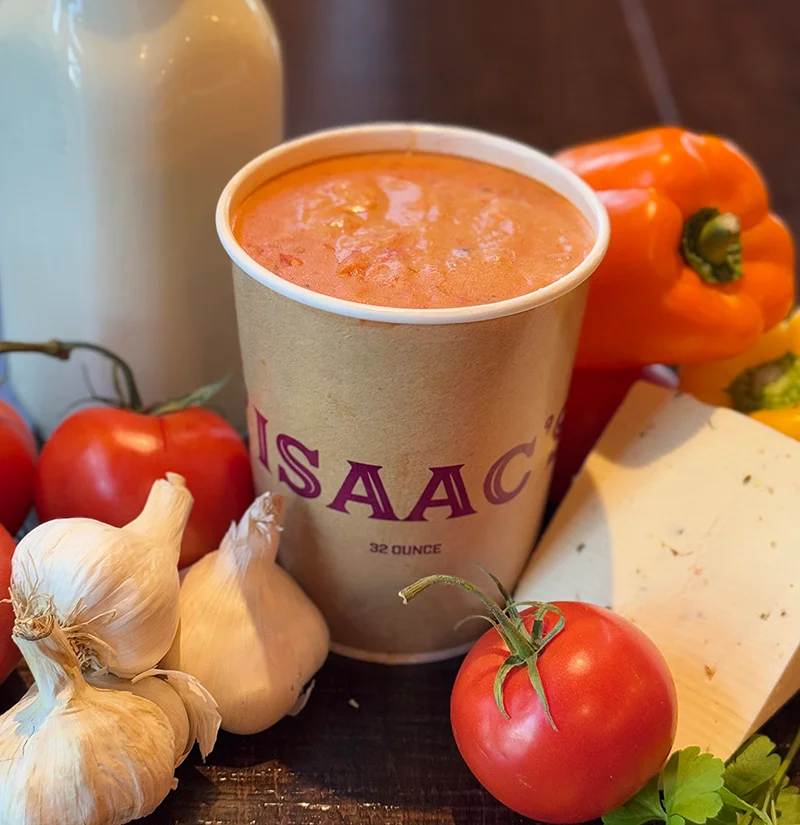 Creamy tomato soup in a takeout cup