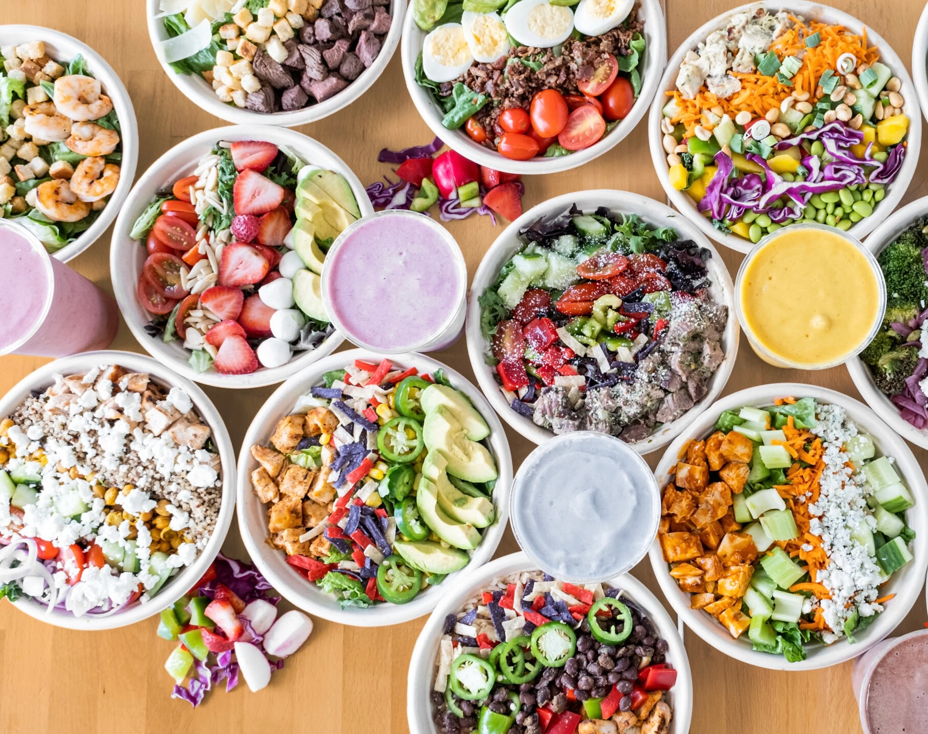 Colorful salad bowls featuring fresh ingredients and vibrant toppings