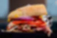 Hearty American sub sandwich loaded with fresh vegetables