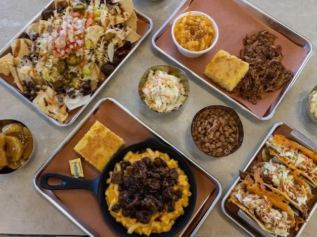 Loaded nachos and BBQ platter in a casual dining setting