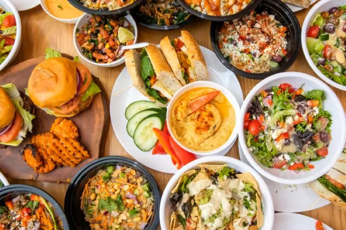 Assorted Mediterranean dishes including hummus, salads, and wraps