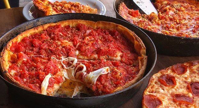 Deep-dish Chicago-style pizza with rich tomato sauce