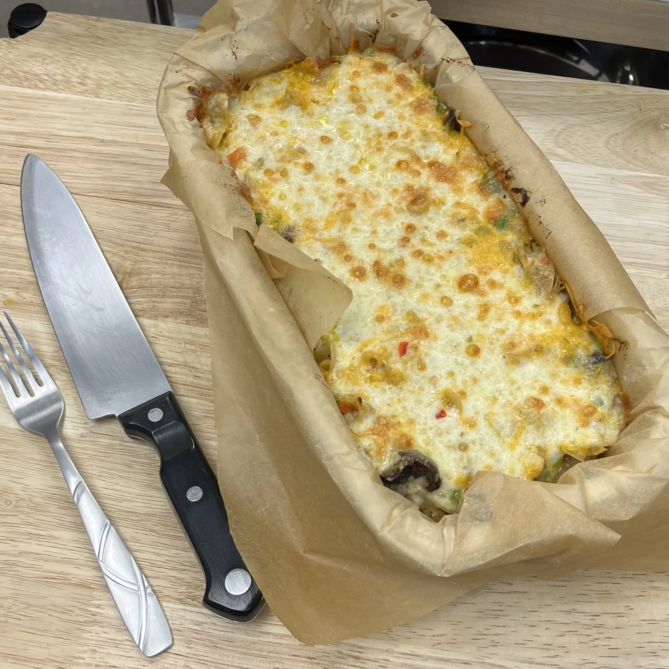 Cheesy baked casserole dish with vegetables