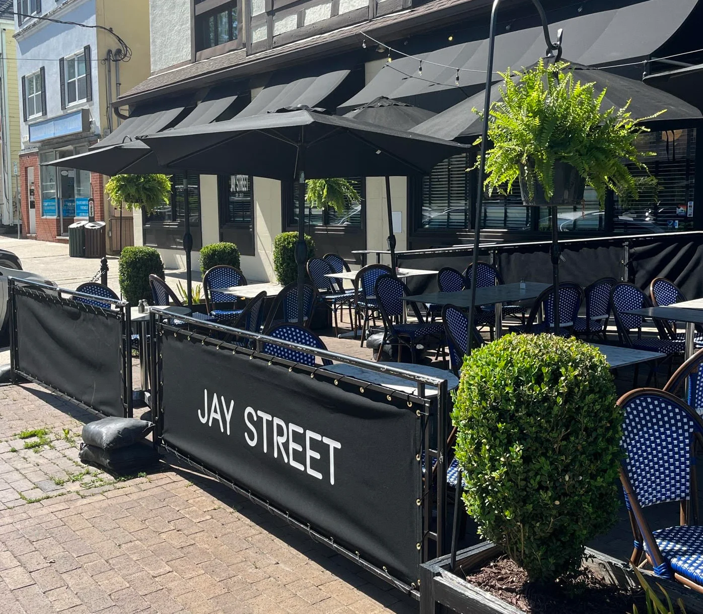 Outdoor dining area of a restaurant with stylish seating