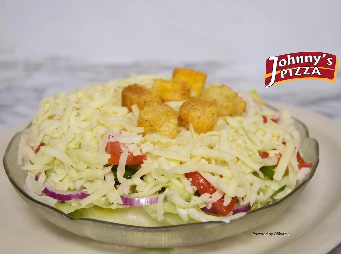 Fresh garden salad topped with cheese and croutons