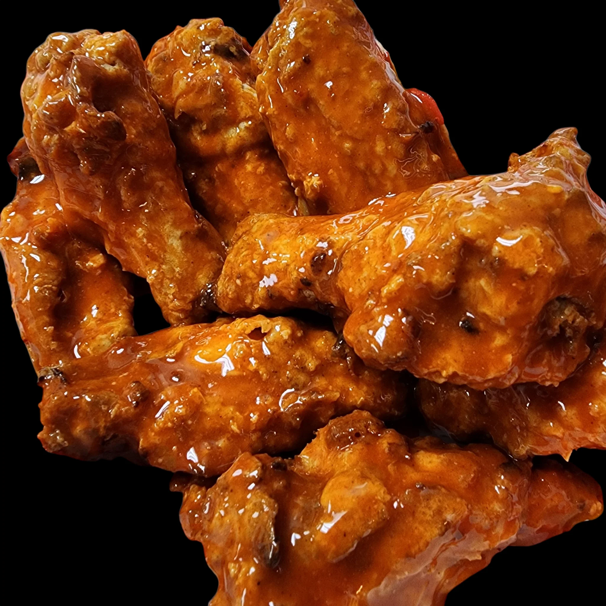 Spicy buffalo chicken wings glazed in sauce