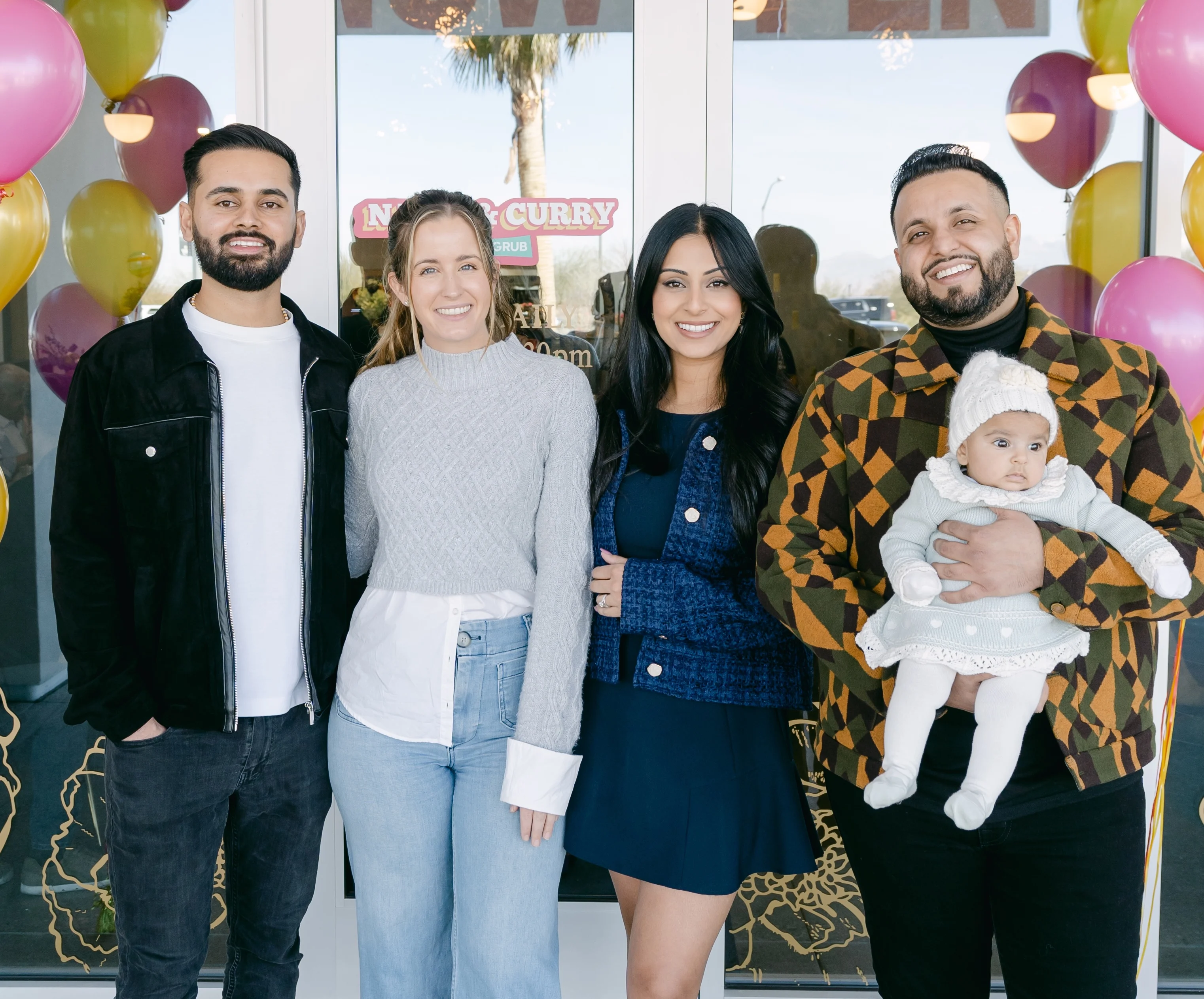 Group of friends celebrating at a restaurant opening
