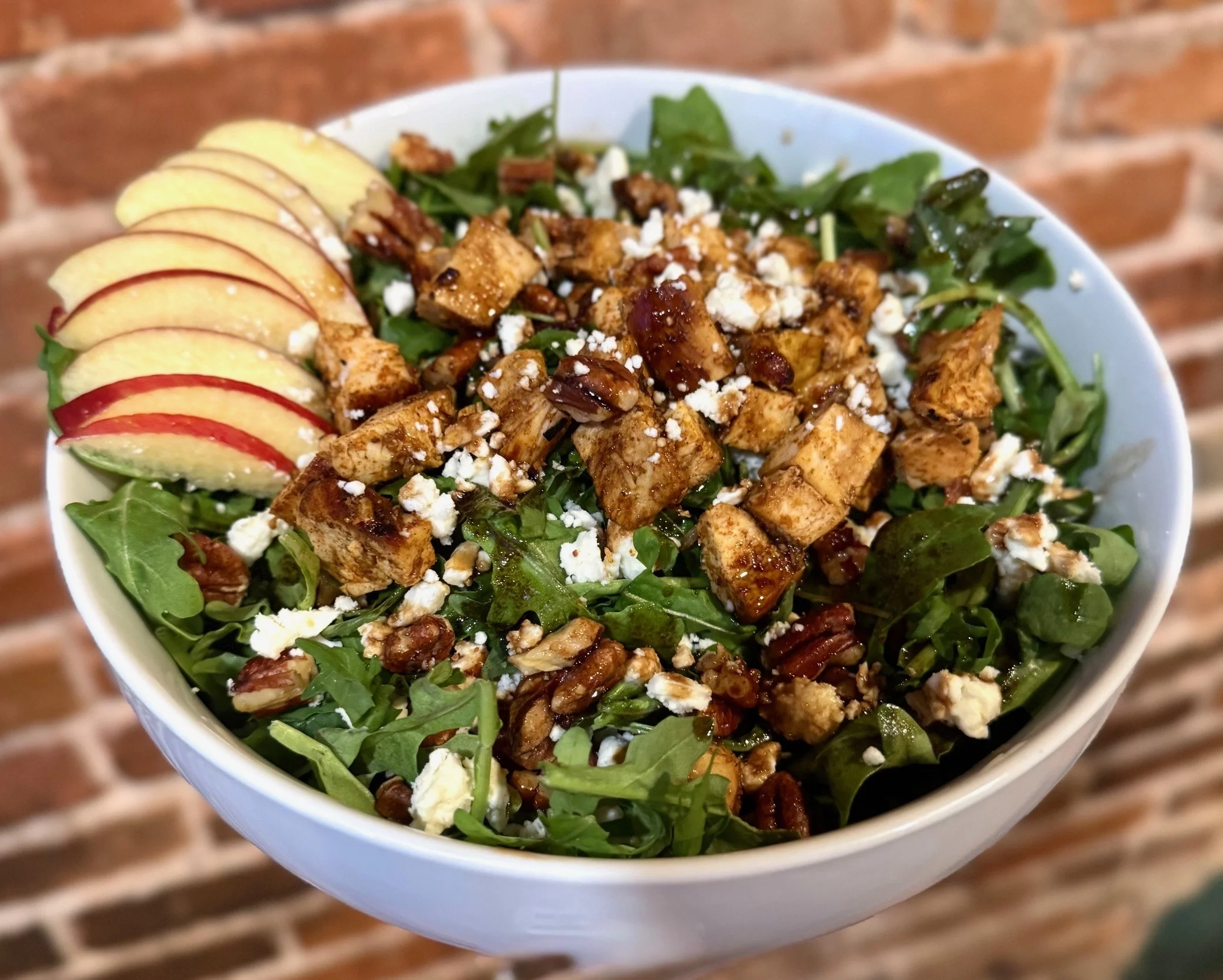 Fresh apple and chicken salad with pecans and feta cheese