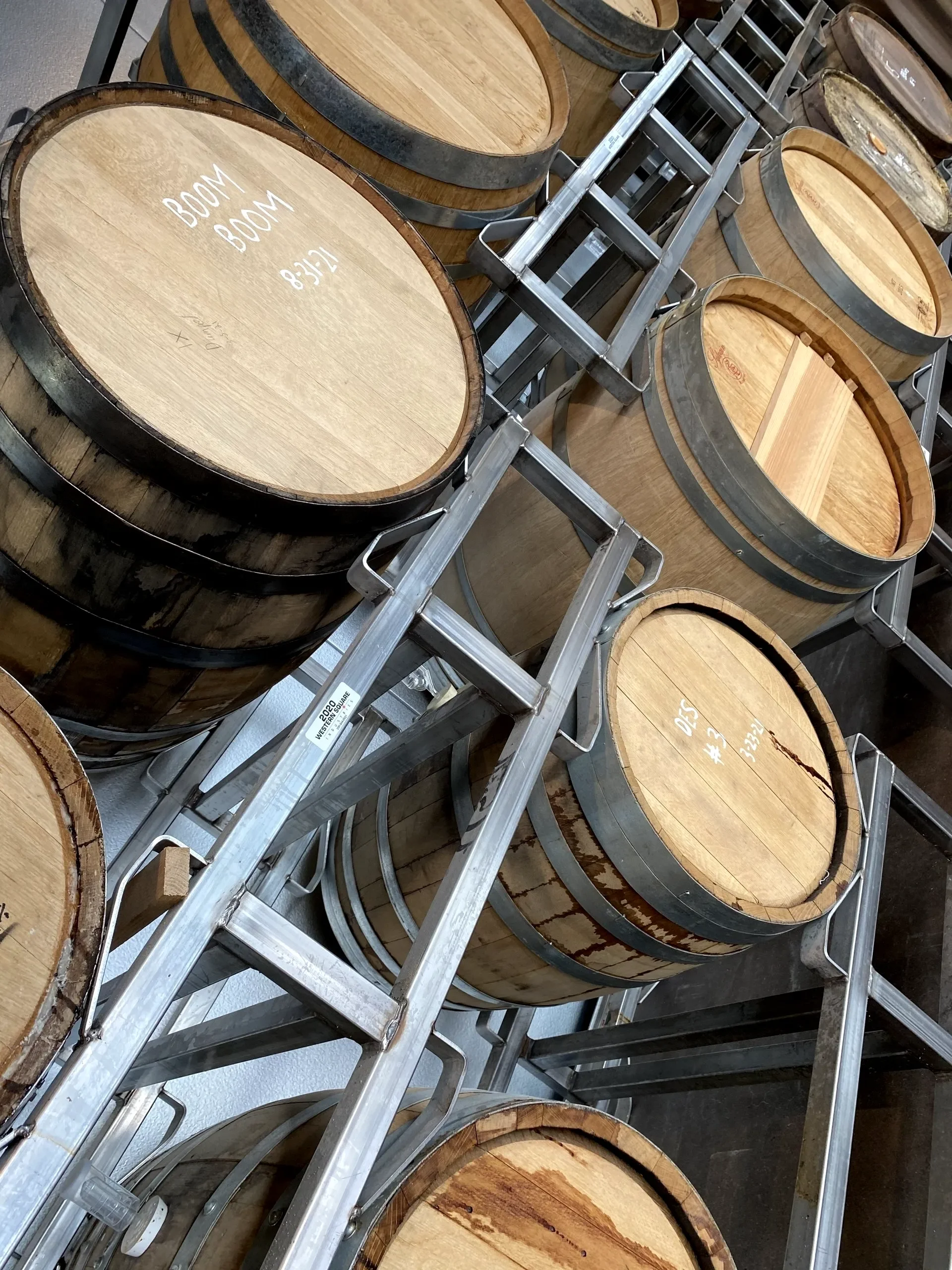 Wooden barrels stacked in a modern winery