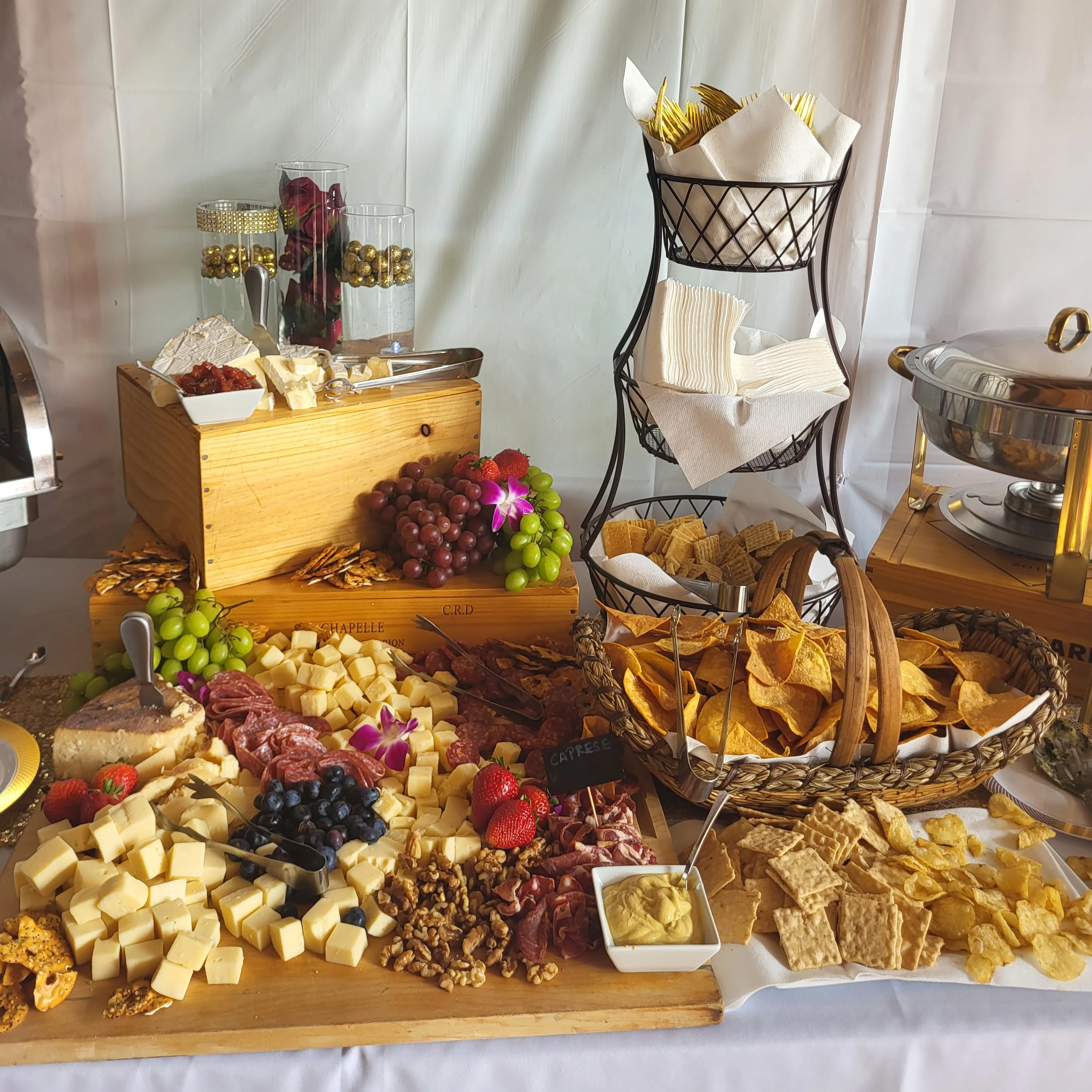 Artisanal cheese and charcuterie board with fresh fruits