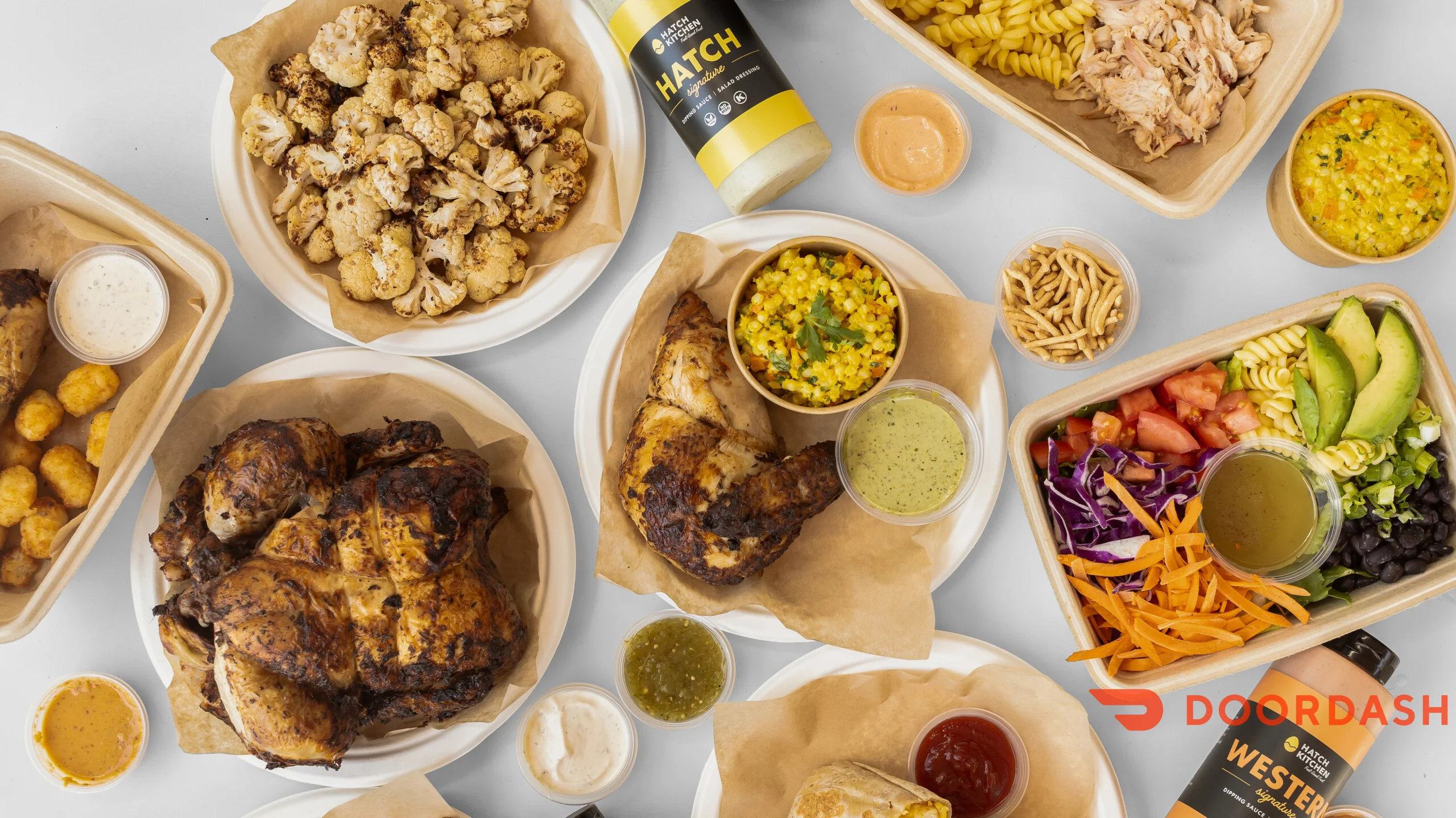 Grilled rotisserie chicken with sides and sauces
