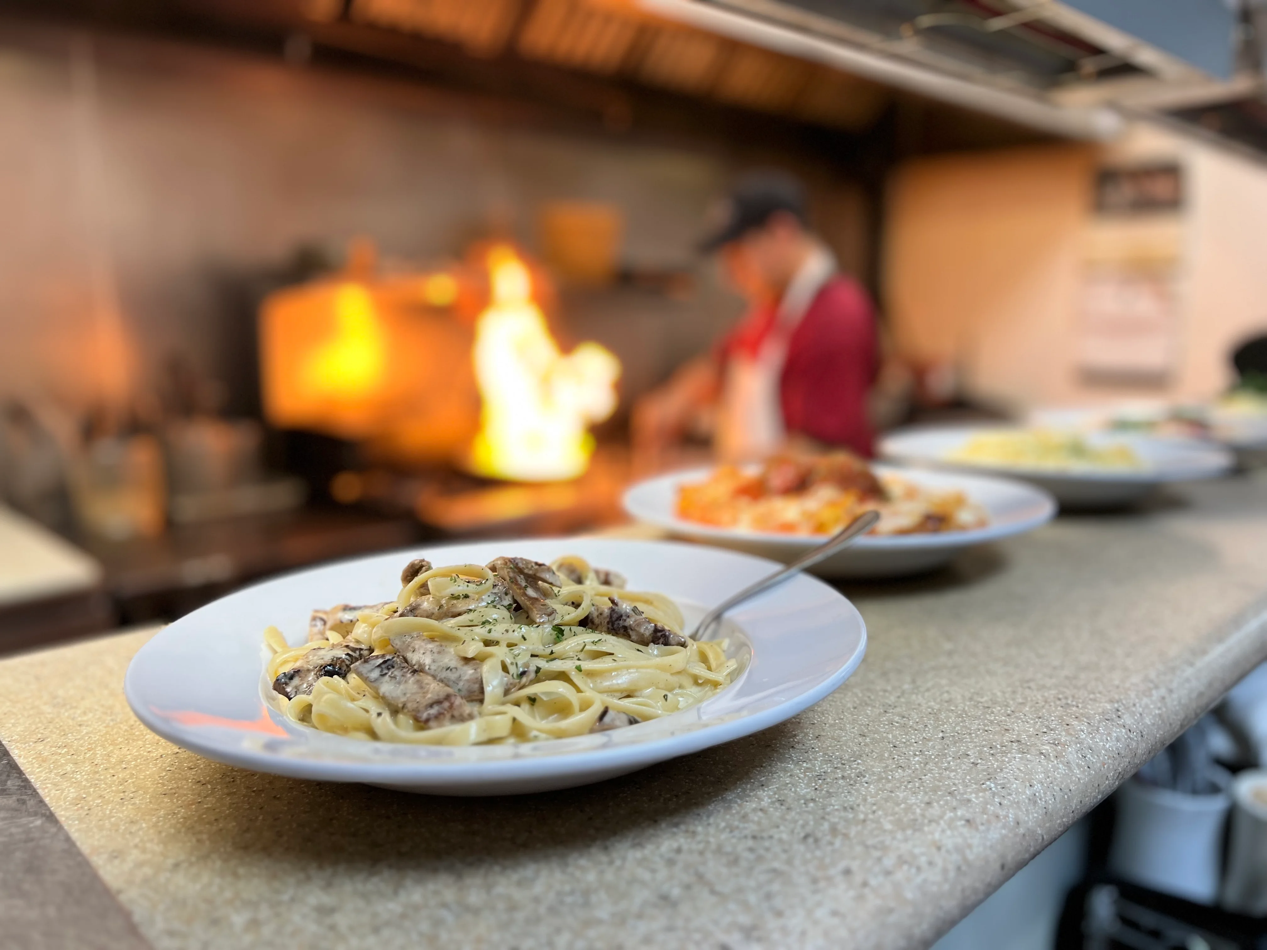 A restaurant chef preparing a dish