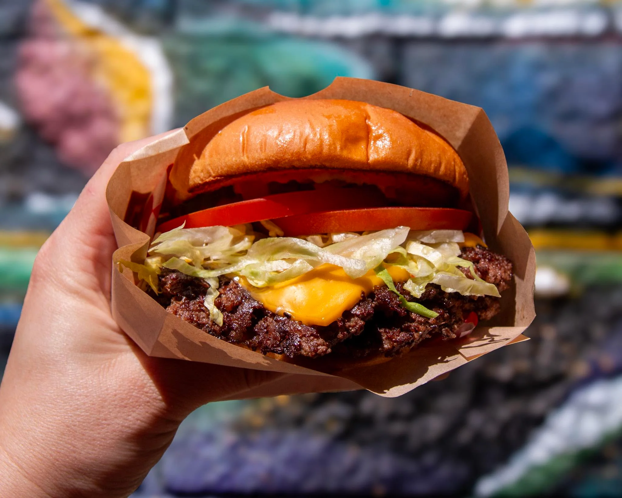 Juicy American cheeseburger with fresh toppings
