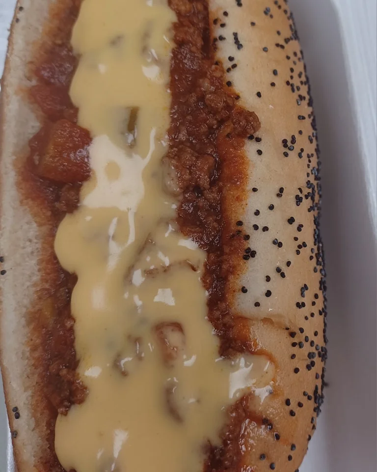 Chili cheese dog with savory toppings