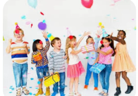 Children celebrating a birthday party with balloons and gifts
