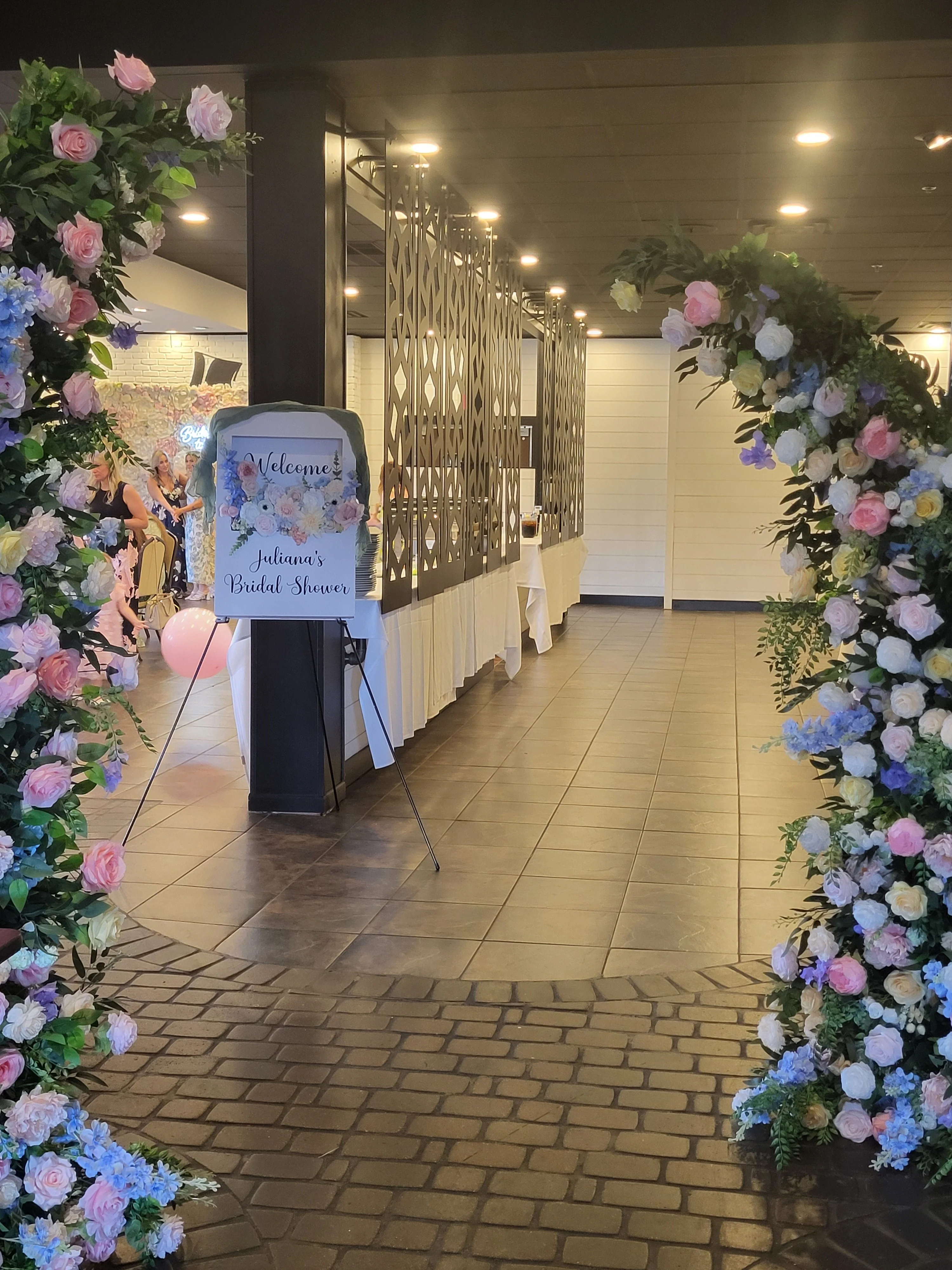 Elegant bridal shower entrance adorned with floral decorations