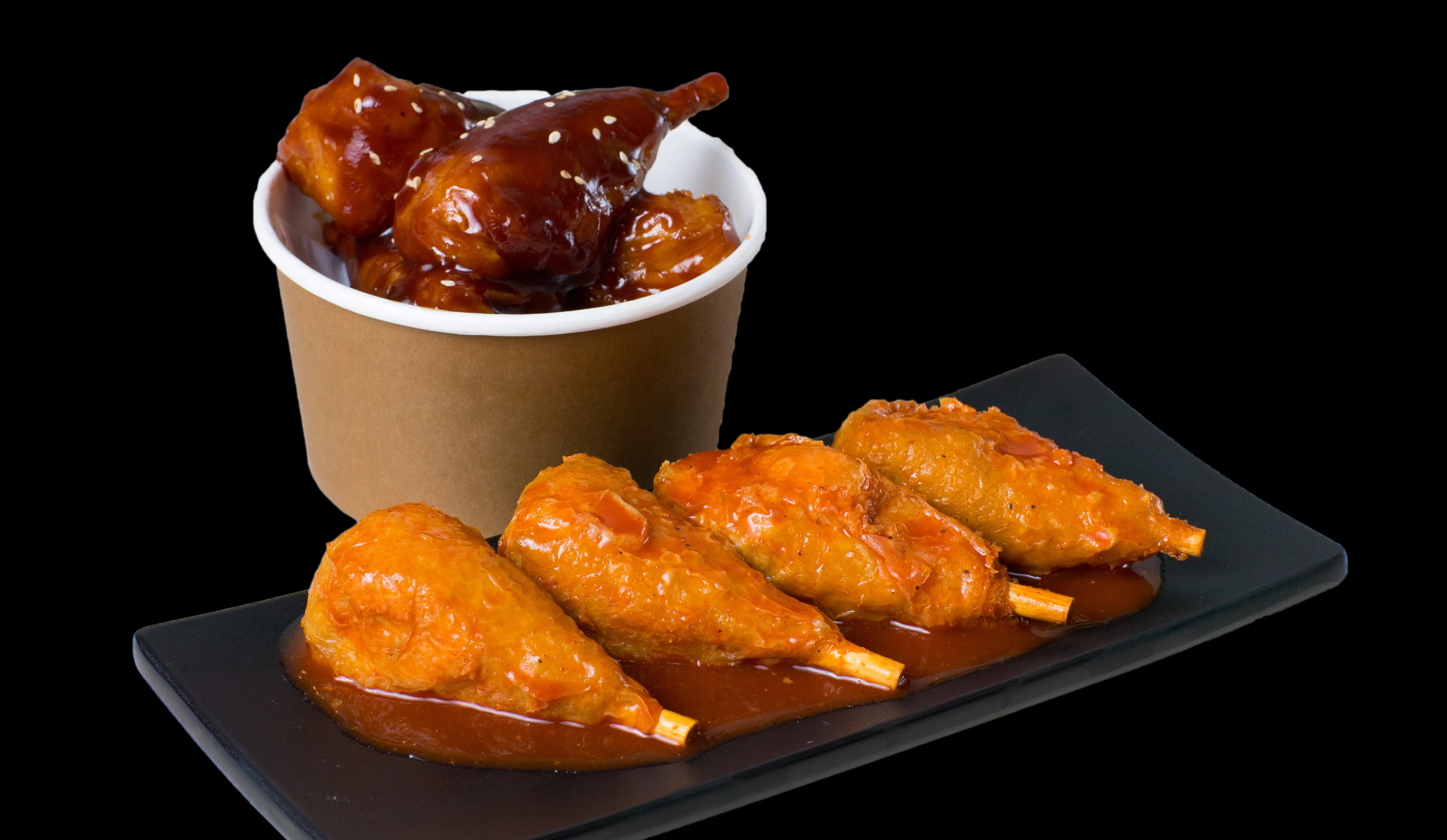 Delicious plate of crispy chicken wings with dipping sauce