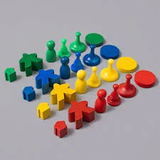 A colorful board game setup with meeples and game pieces on a table.