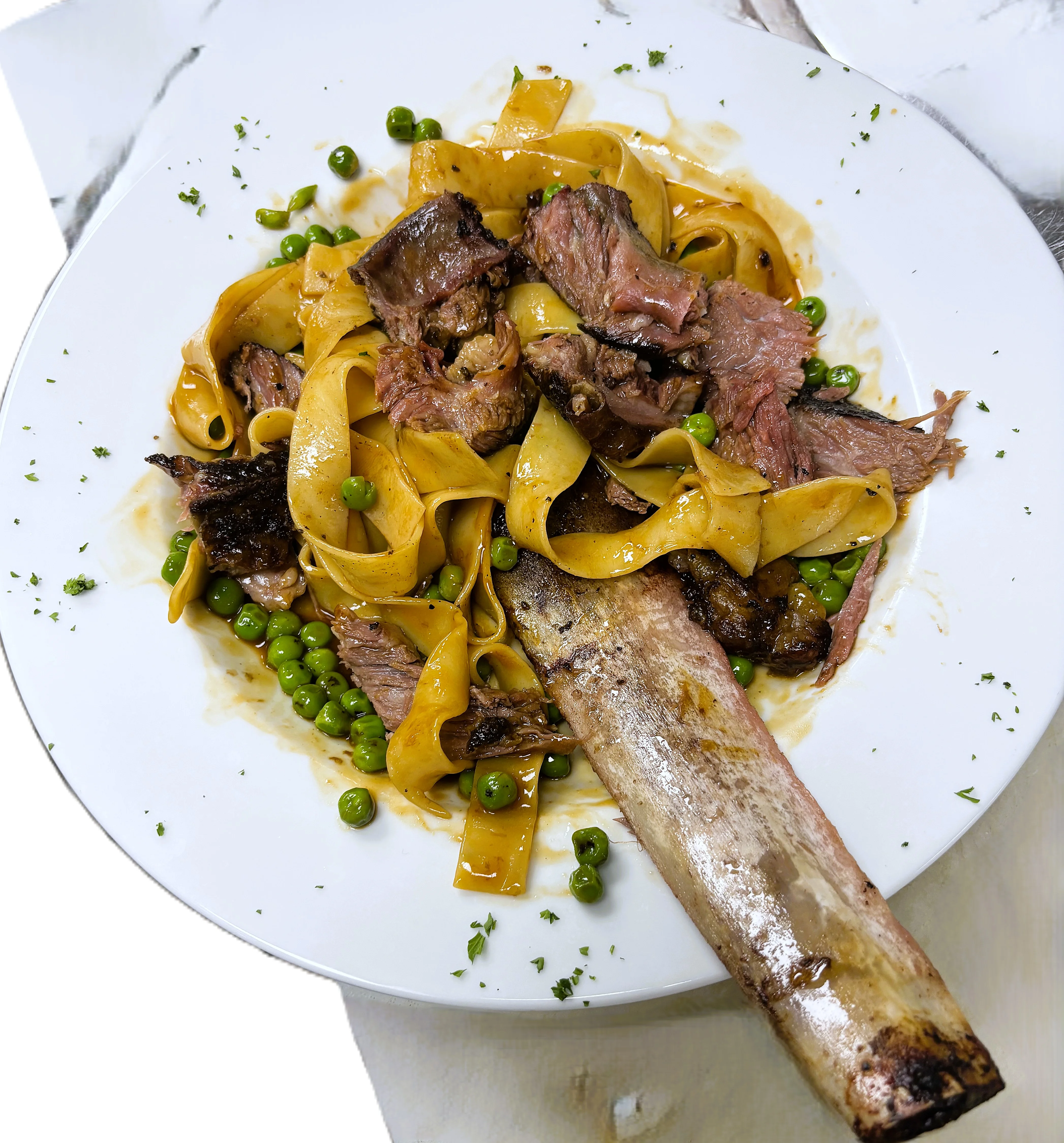 Italian pappardelle with braised beef and peas