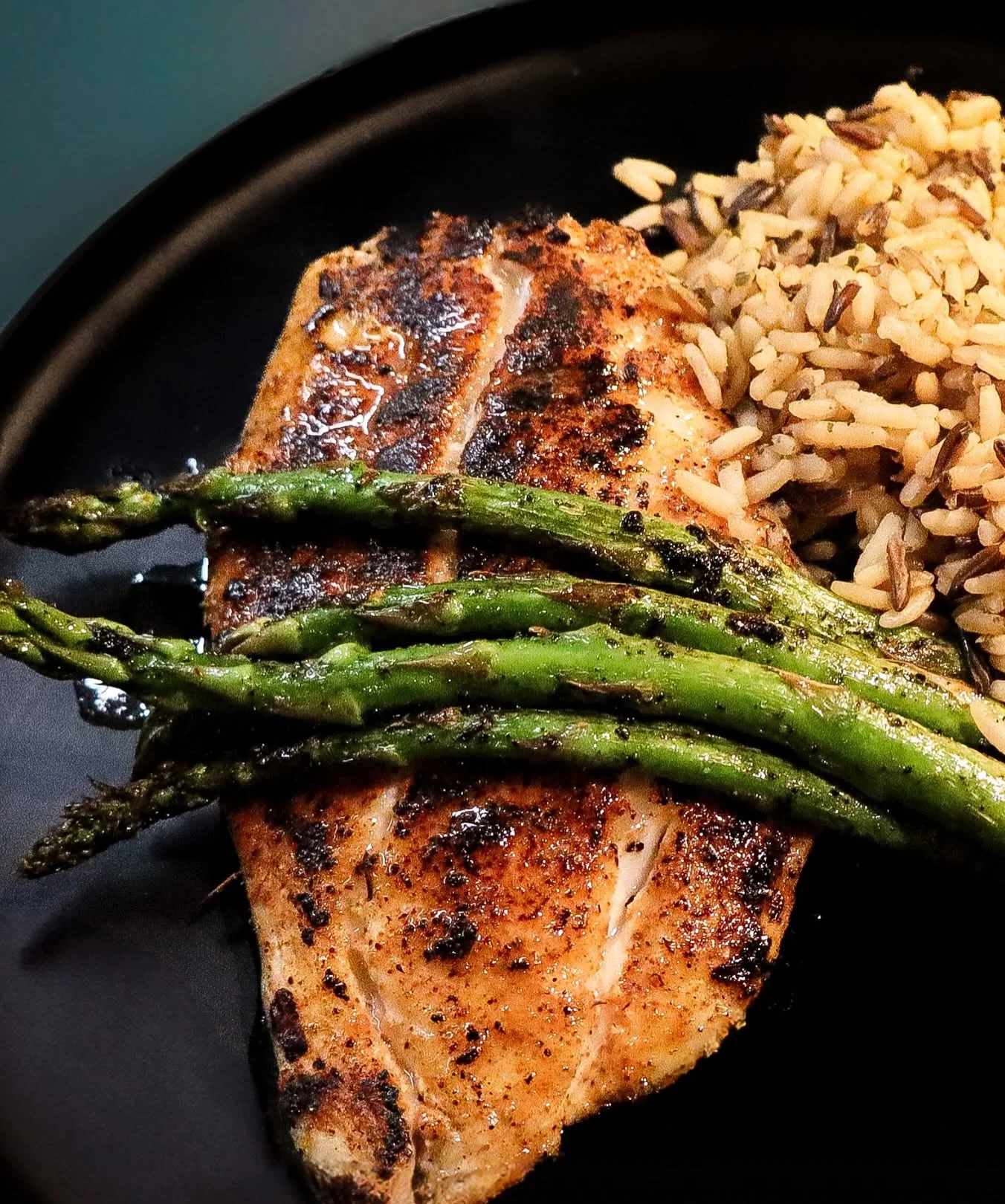 Grilled fish with asparagus and rice, a classic American dish