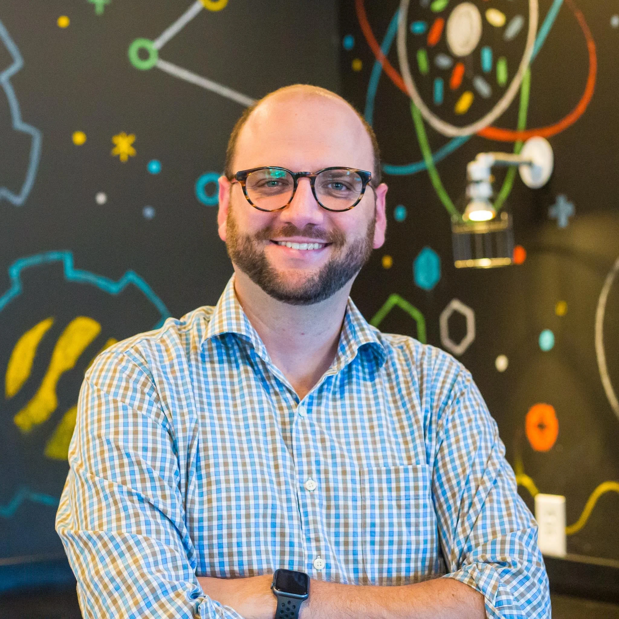 Smiling professional in a creative workspace