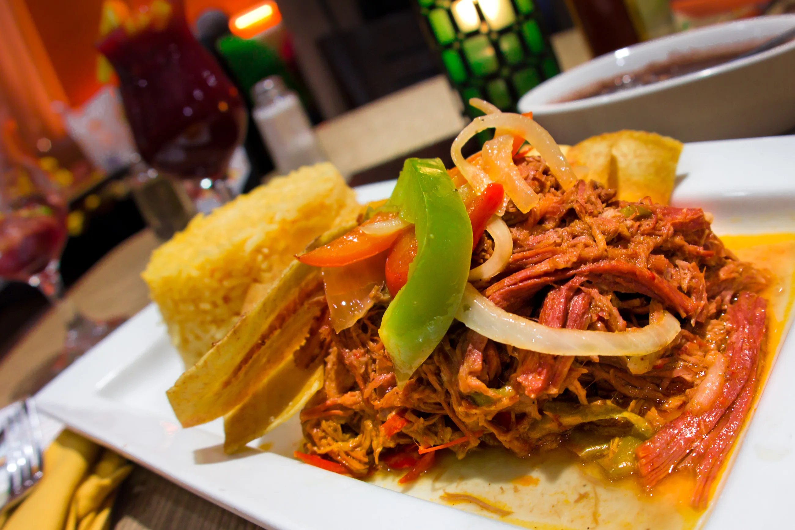 Cuban ropa vieja served with rice and plantains