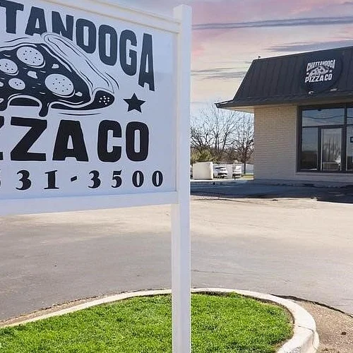 Exterior view of Chattanooga Pizza Co with open sign.
