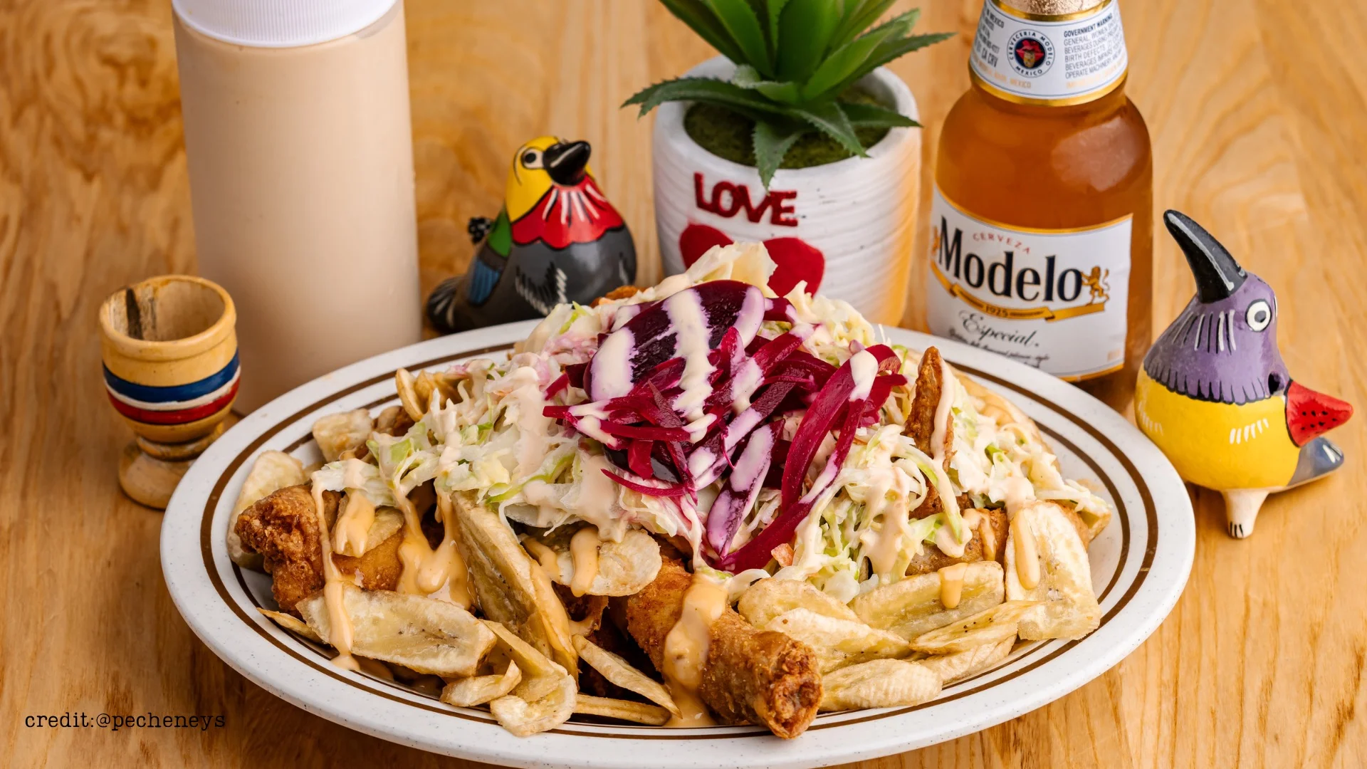 Delicious Mexican nachos topped with creamy sauce and fresh vegetables