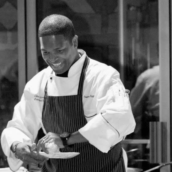 Chef preparing a gourmet dish in a modern kitchen