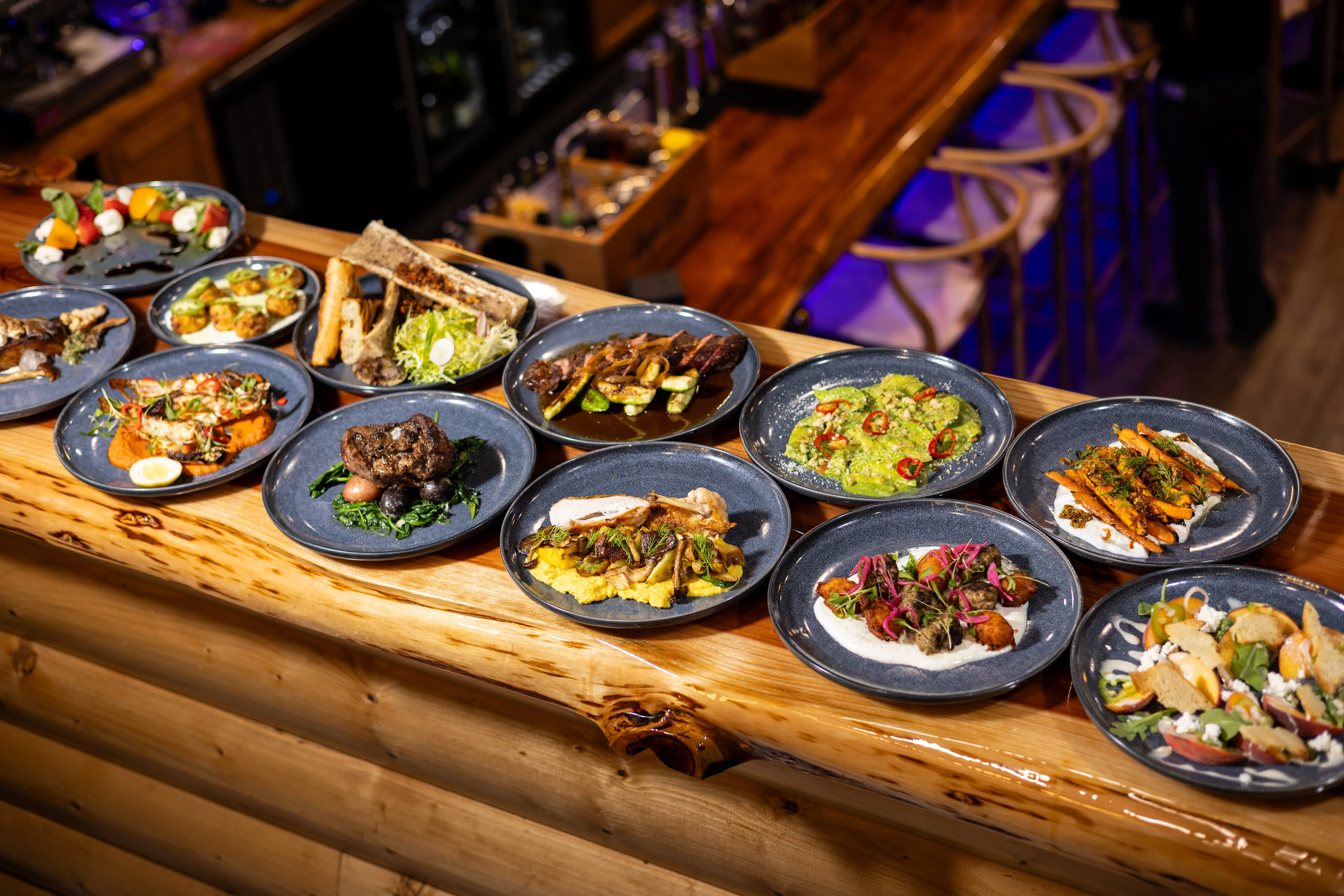 Assorted Latin American dishes on rustic wooden table