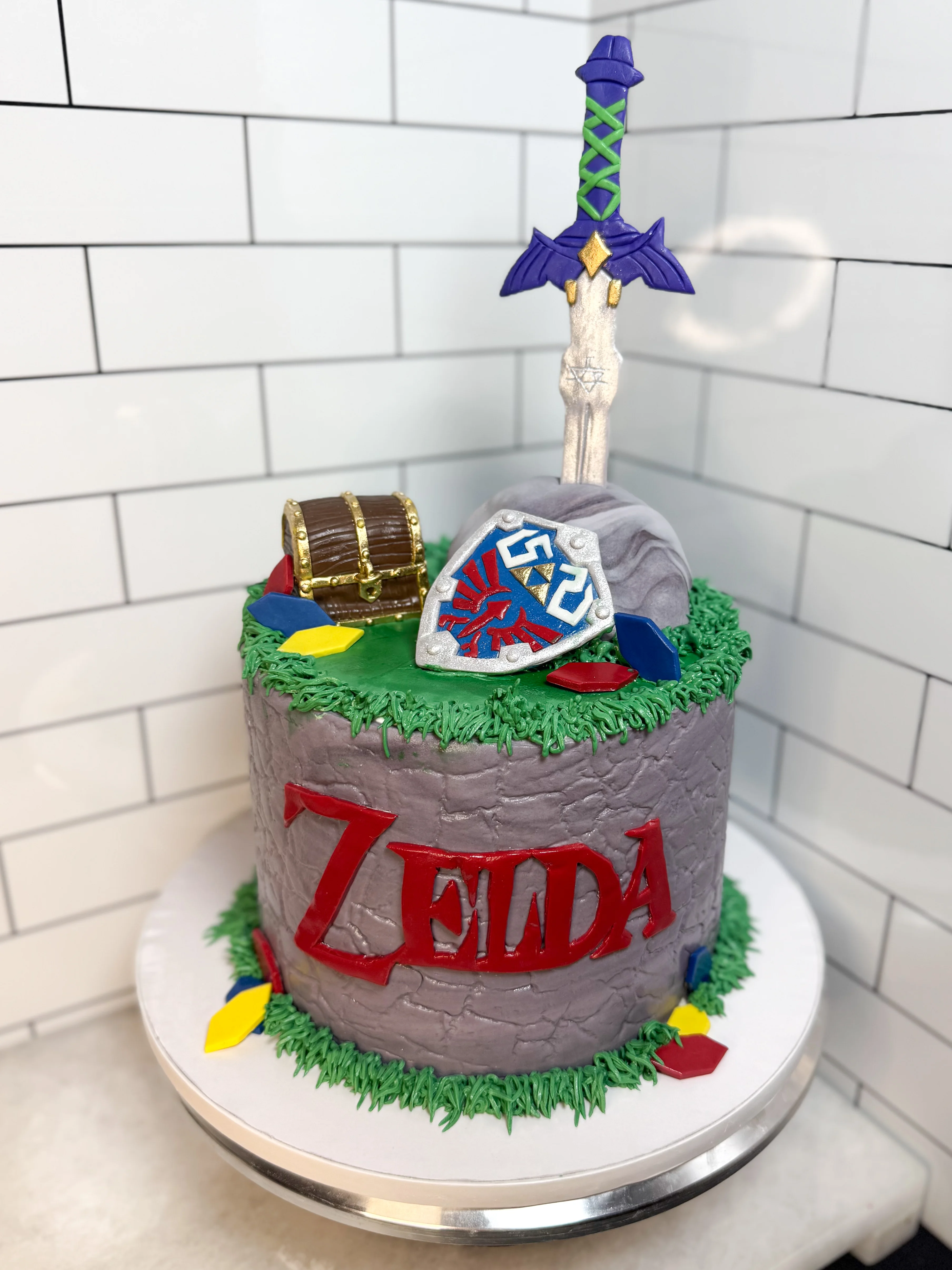Themed cake inspired by a fantasy video game with sword and shield decorations