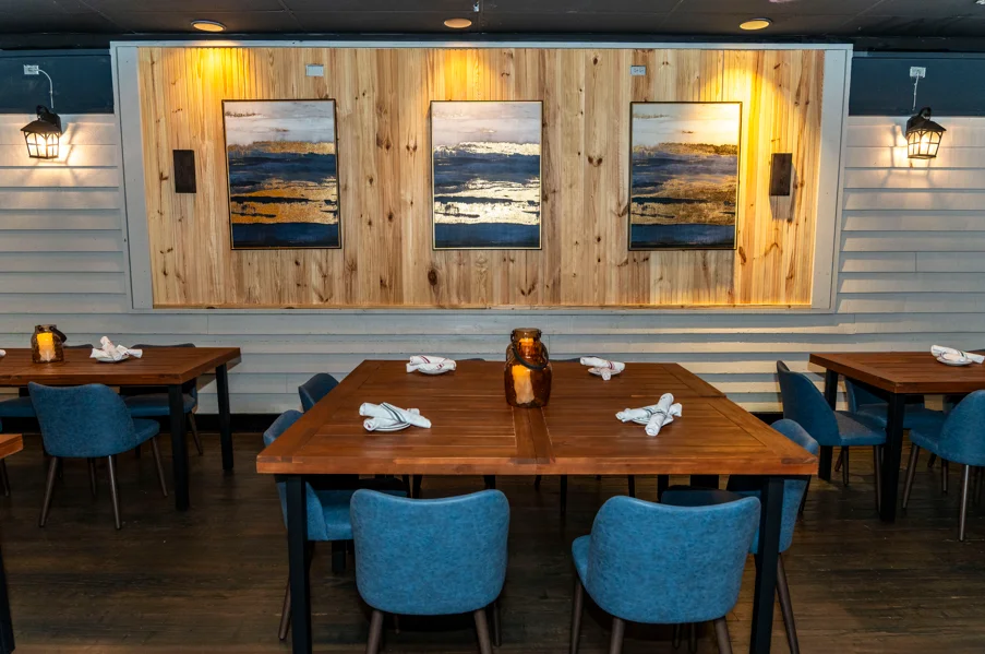 Spacious party room with elegant decor and seating for gatherings.