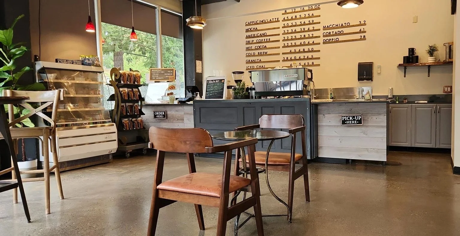 Cozy coffee shop interior with wooden furniture and menu board