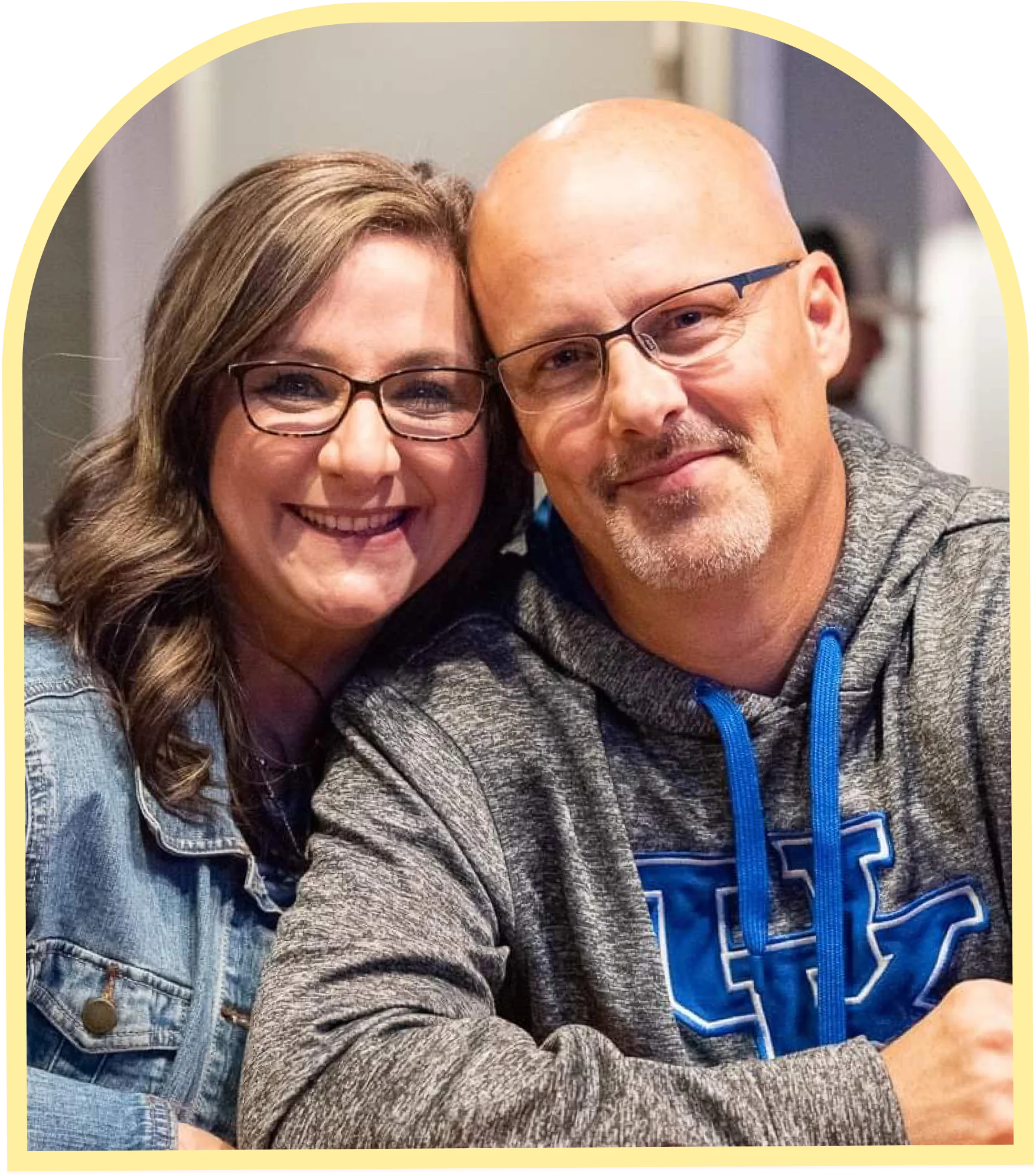 Couple smiling together in a cozy restaurant setting
