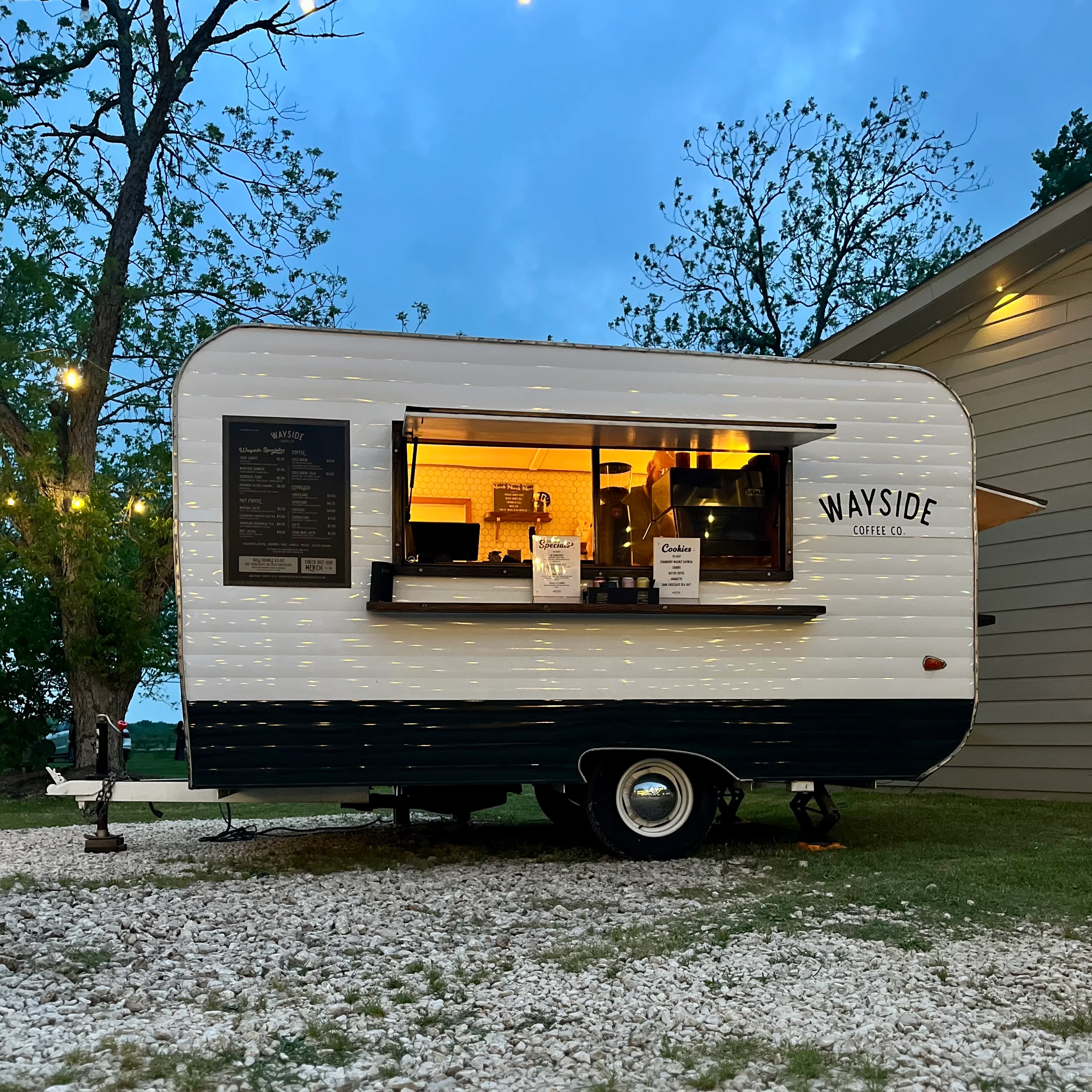 A vibrant food truck serving delicious meals in a lively outdoor setting.